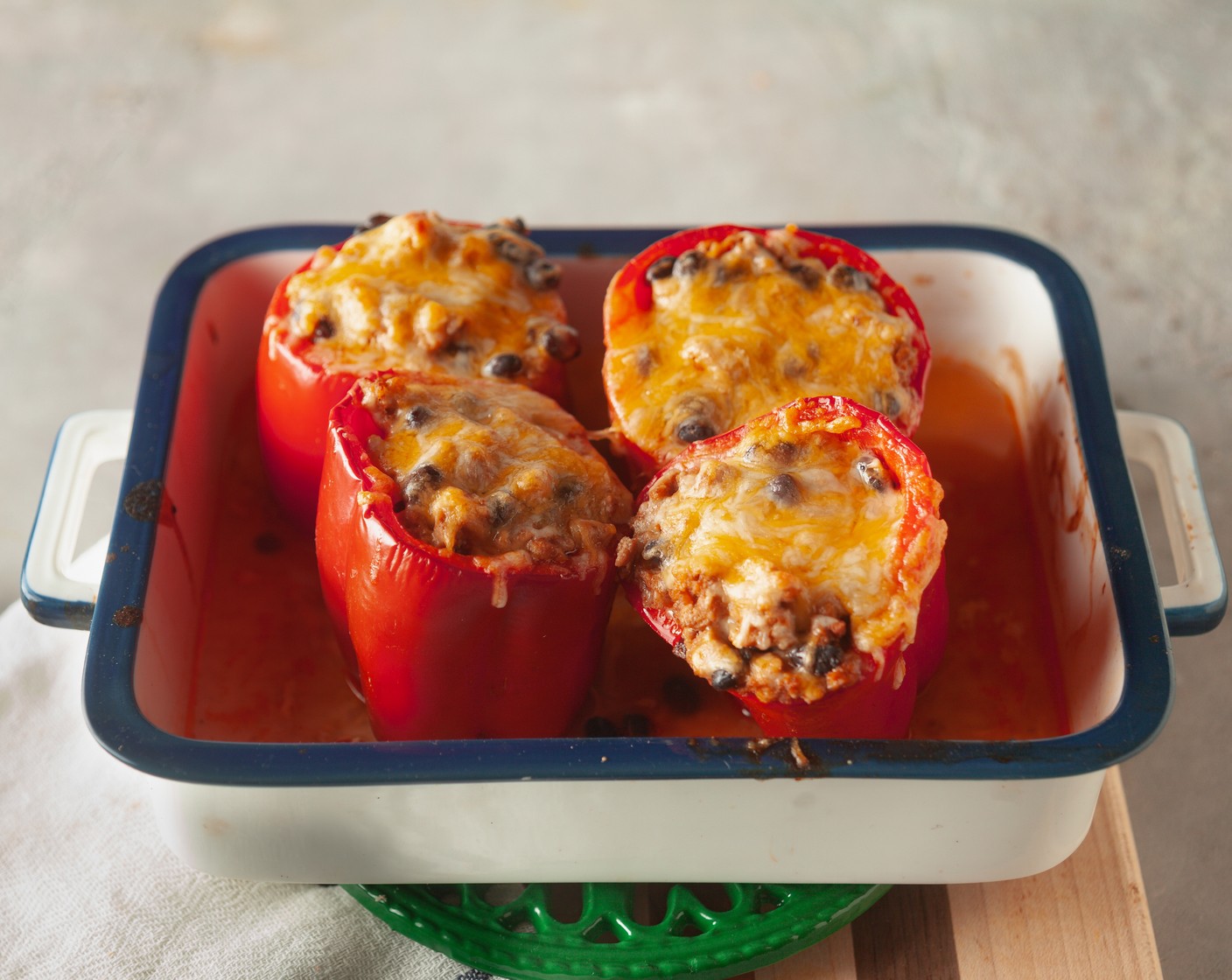 step 7 Uncover the peppers and sprinkle the remaining Shredded Mexican Cheese Blend (1/2 pckg) on top. Return to the oven and bake for 5 minutes, until the cheese is melted.