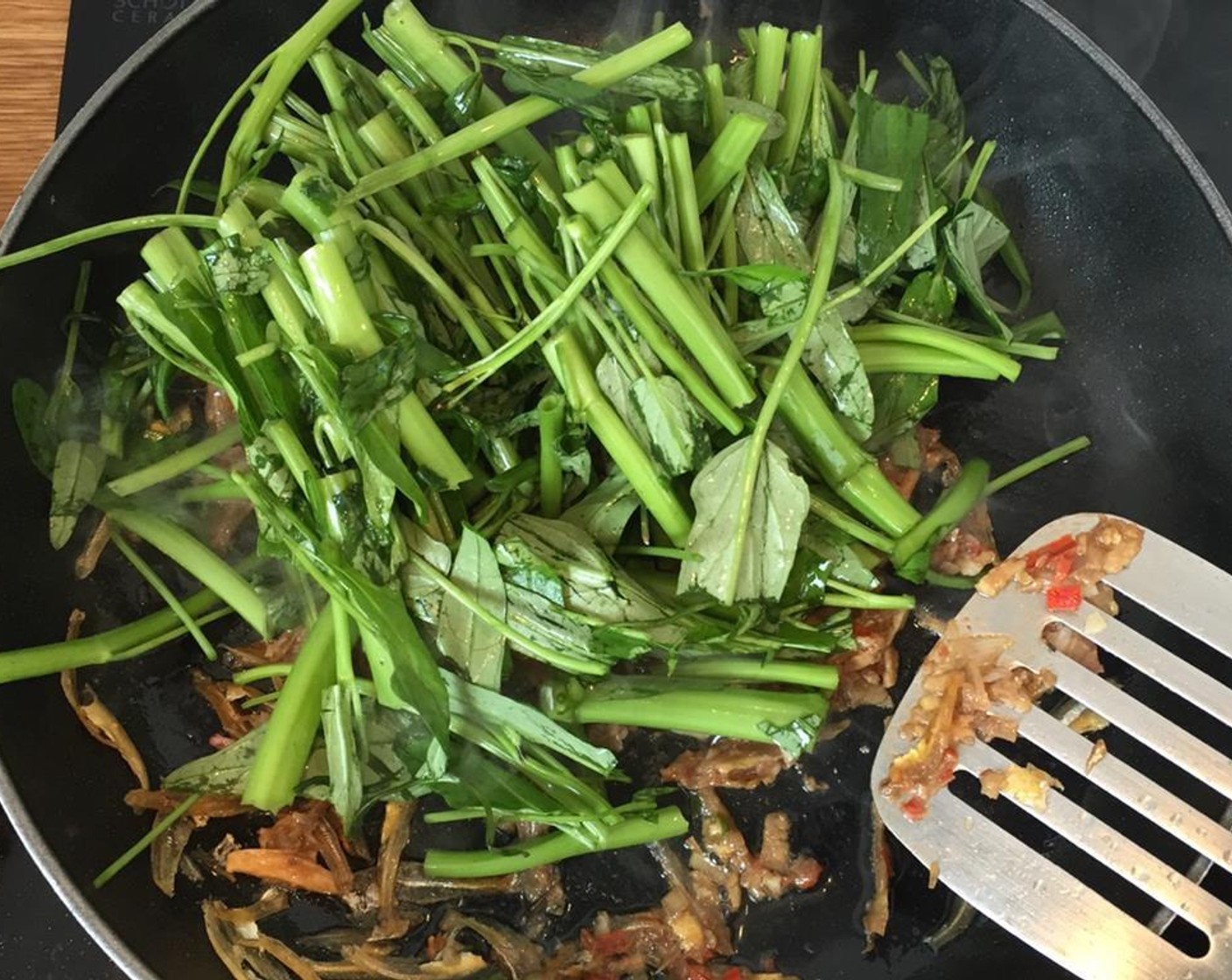 step 6 Add stems only into the pan and cook for 3 minutes.