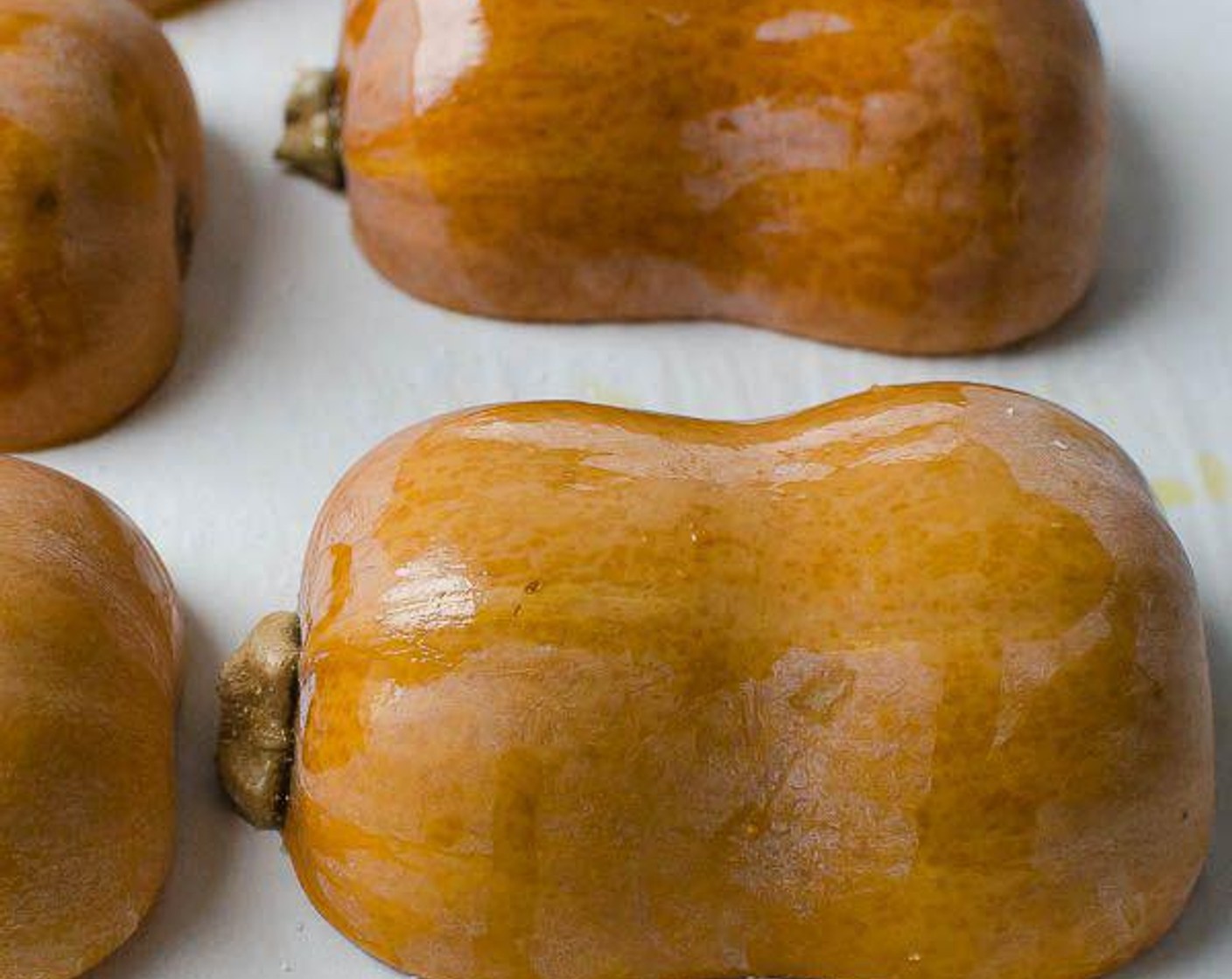 step 4 Sprinkle with Salt (1 pinch) and place the squash cut-side-down onto the baking sheet. Roast for 20 minutes.