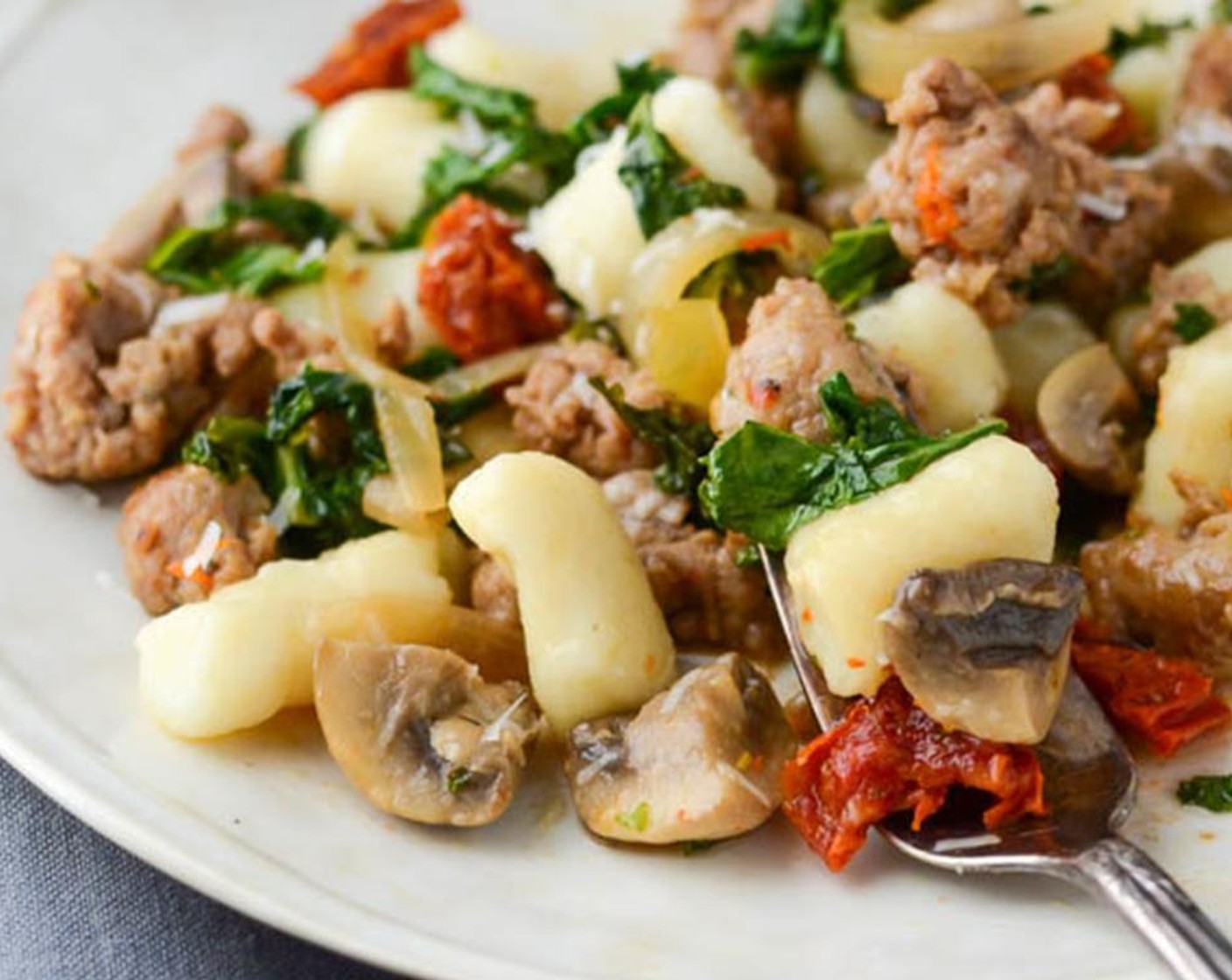 step 9 Add the Gnocchi (2 cups) and toss. Stir in the Parmesan Cheese (1/2 cup) and serve with extra Parmesan Cheese (to taste) for garnish.