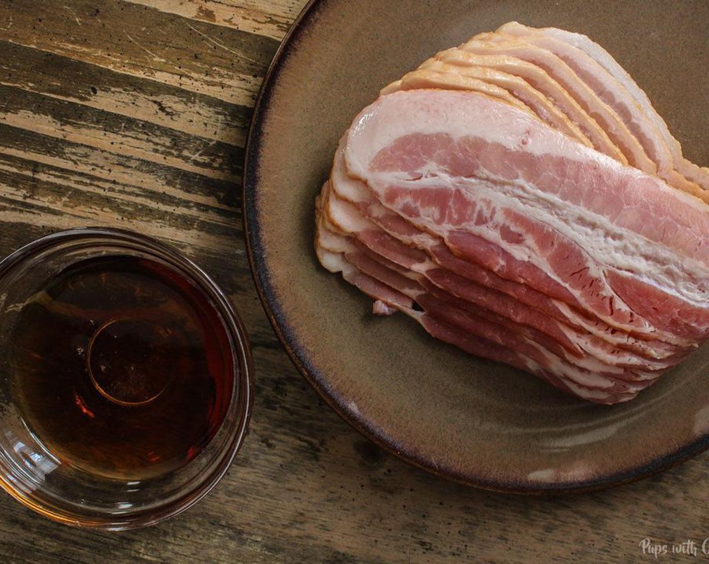 step 1 Lay out parchment paper over a cookie sheet and layout the Bacon (6 slices) 1 at a time side by side.