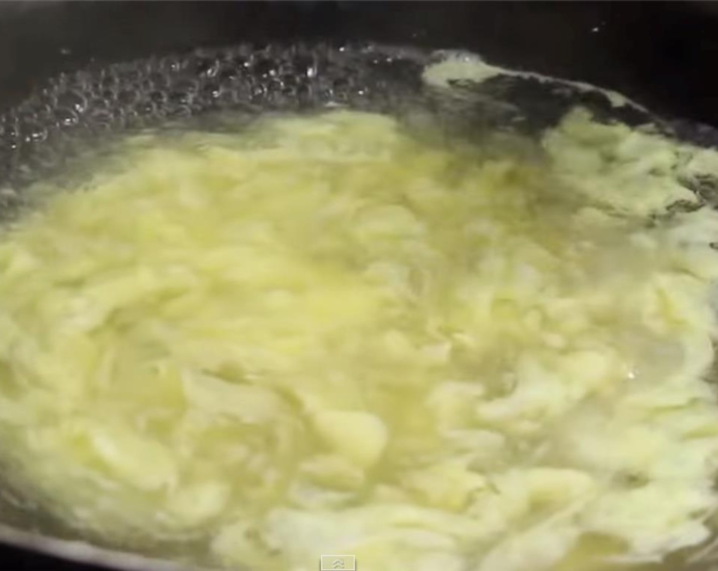 step 7 Use a ladle to gently push the soup in a forward motion. Do it several times until the egg forms strands in the soup. Add in Sesame Oil (1 tsp) and stir.