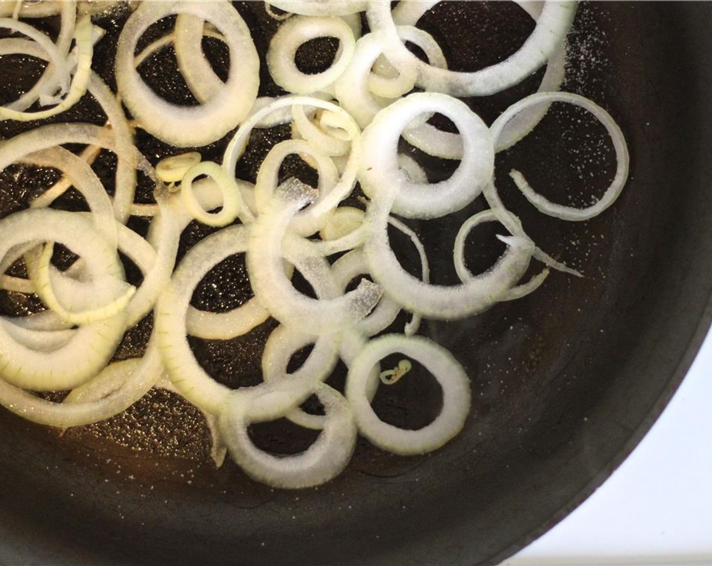 step 4 In a large frying pan over medium-high heat, melt half of the Butter (1/2 Tbsp) and add the onion. Salt (to taste) and cook until browned and soft for about 6 minutes