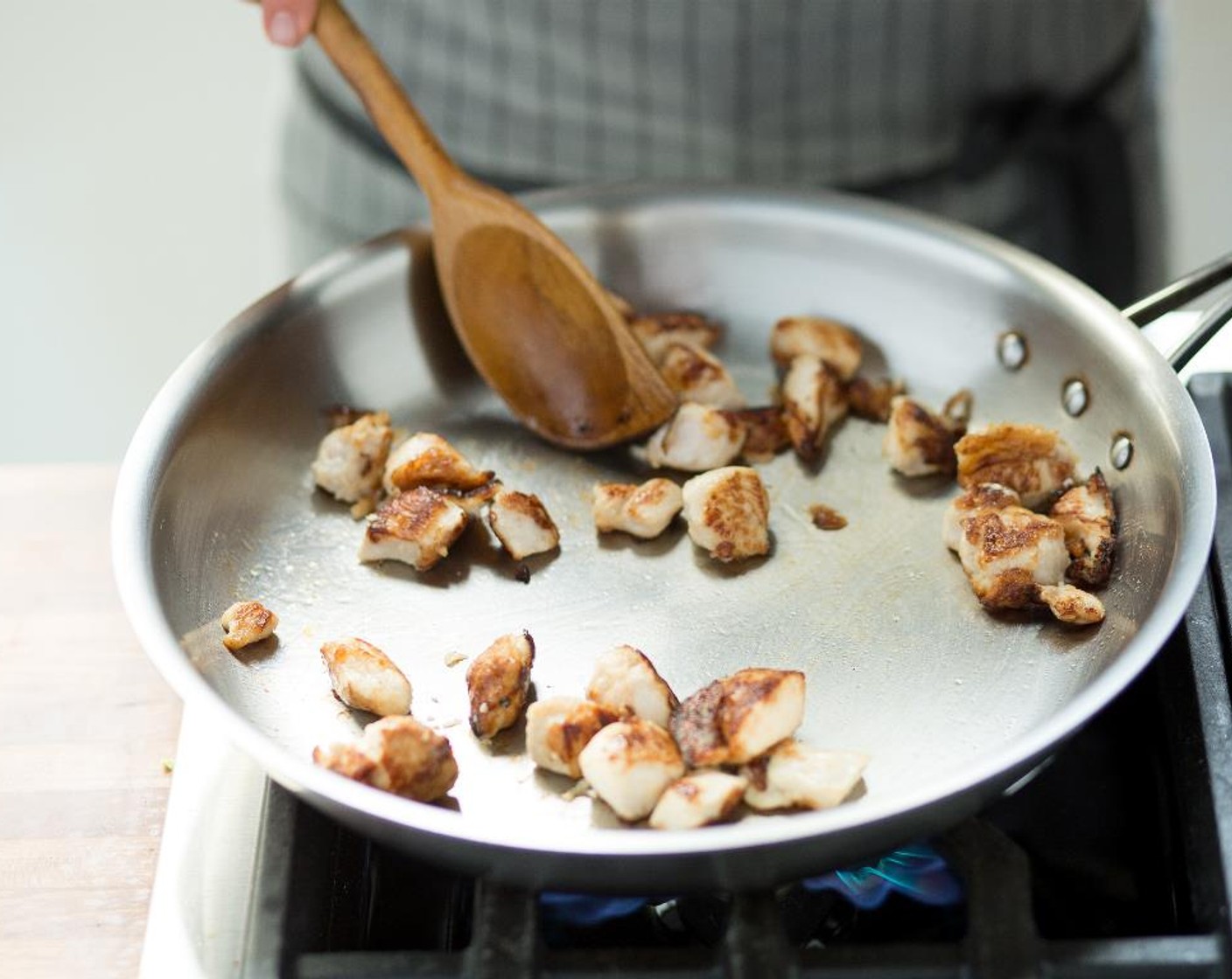 step 9 When the oil is hot, add the chicken and quickly stir-fry for 5 minutes. Remove the chicken from the pan and add more Canola Oil (1 Tbsp).