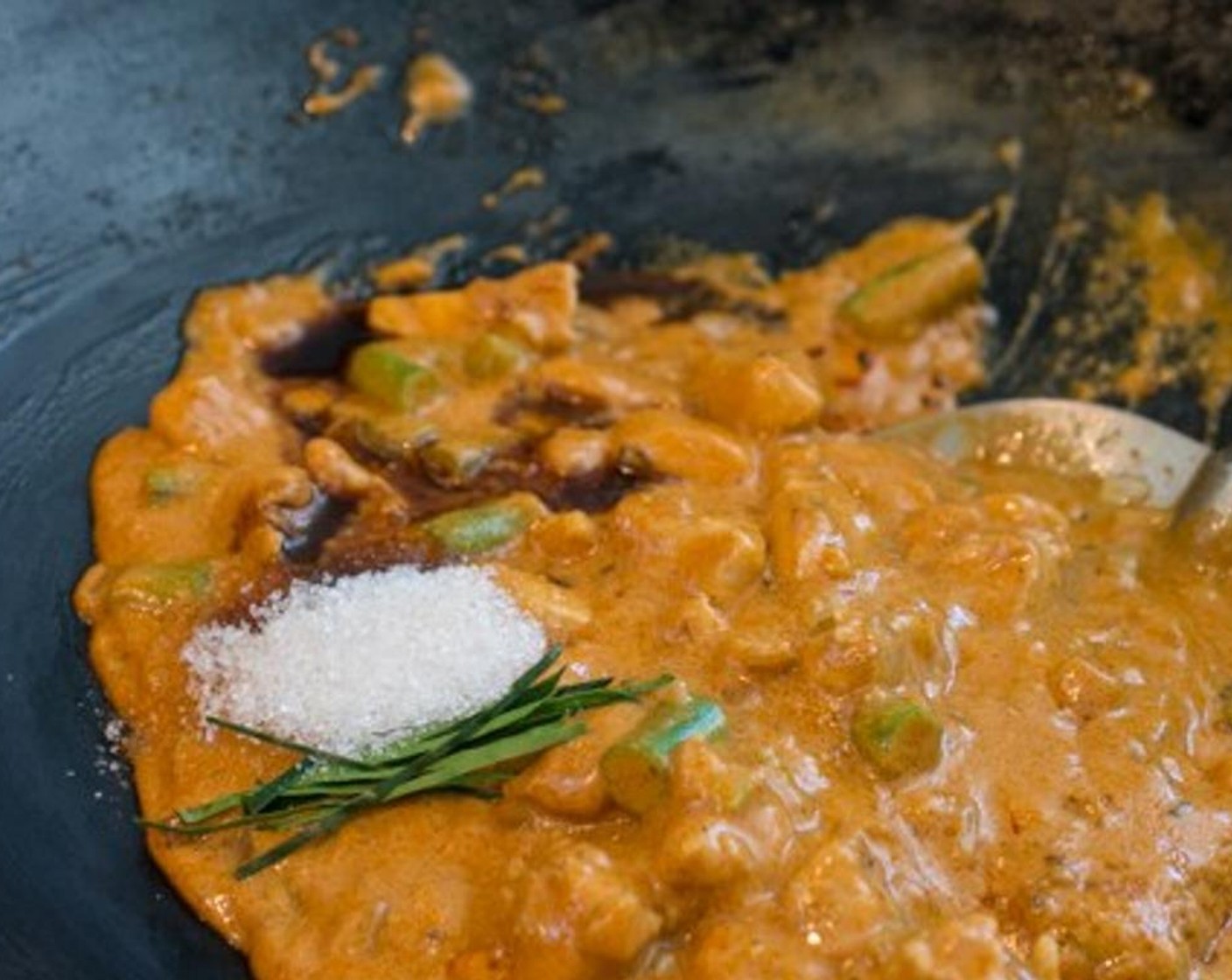 step 10 Add Granulated Sugar (1 Tbsp), Fish Sauce (1 tsp) and half of the Kaffir Lime Leaf (1). Stir to incorporate all the ingredients, then transfer to a large bowl. Set aside.