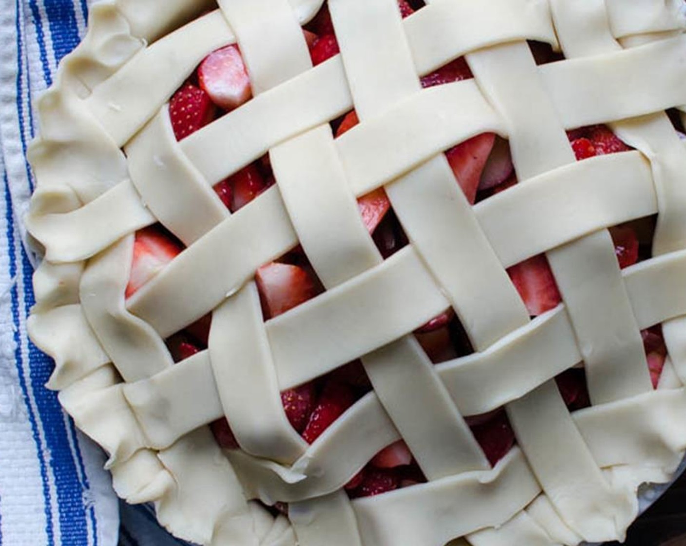 step 5 Weave a lattice crust, then tuck any loose ends underneath the overhang of the bottom crust and pinch the edges into a decorative border. Brush the crust with the Heavy Cream (2 Tbsp) and sprinkle with Demerara Sugar (2 Tbsp).