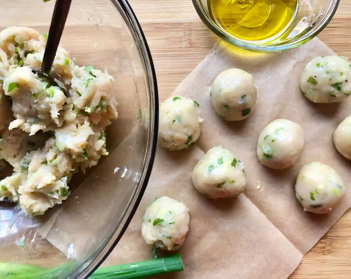 step 2 Coat your hands with a bit of oil, and roll the meat into tablespoon-size spheres. This should make about 15-20 meatballs.