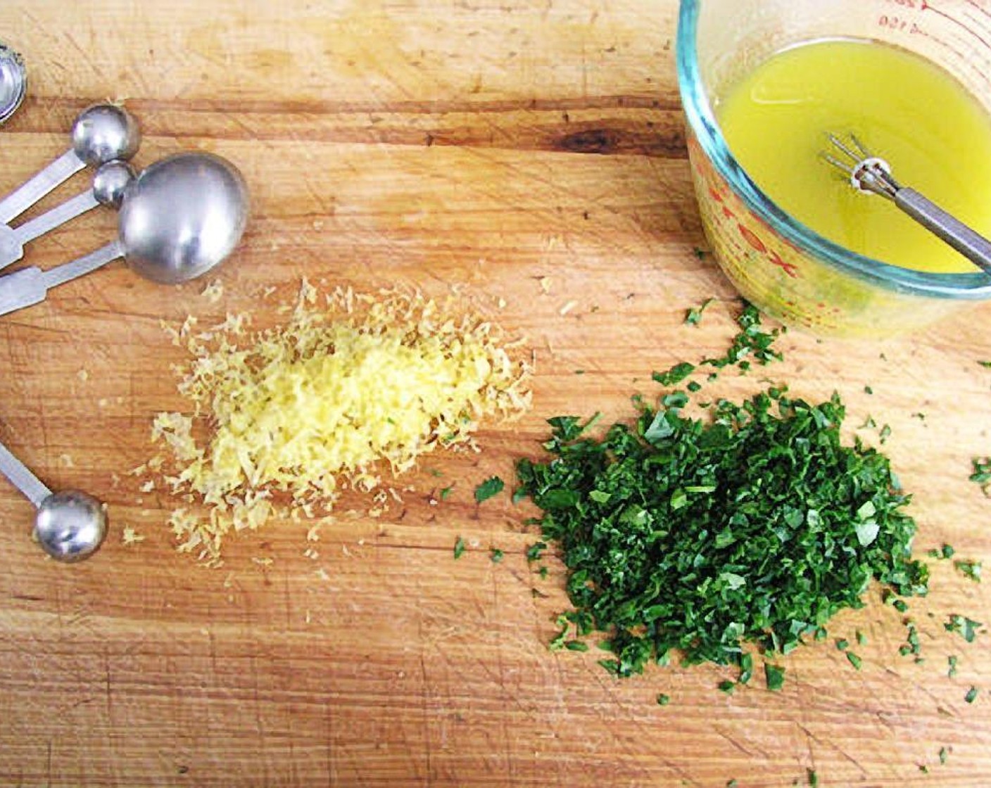 step 2 Whisk Olive Oil (2/3 cup), Dijon Mustard (1/2 Tbsp), Garlic (2 cloves), juice of Lemons (2), Kosher Salt (1/2 tsp) and Ground Black Pepper (1 pinch) together in a small bowl. Set aside, keeping the dressing at room temperature.