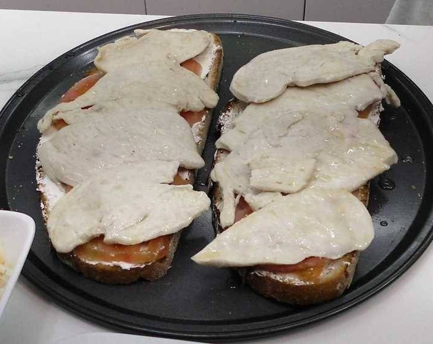 step 3 Spread Cream Cheese (to taste) on the Bread (to taste) slices. Add Tomatoes (2) and the chicken fillets to each sandwich.