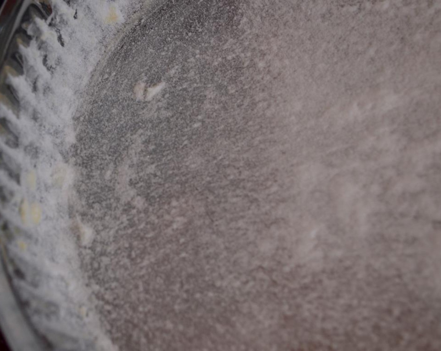 step 1 Line the interior of a glass baking dish with Butter (1/2 Tbsp) and sprinkle with spoonful of Powdered Confectioners Sugar (to taste).