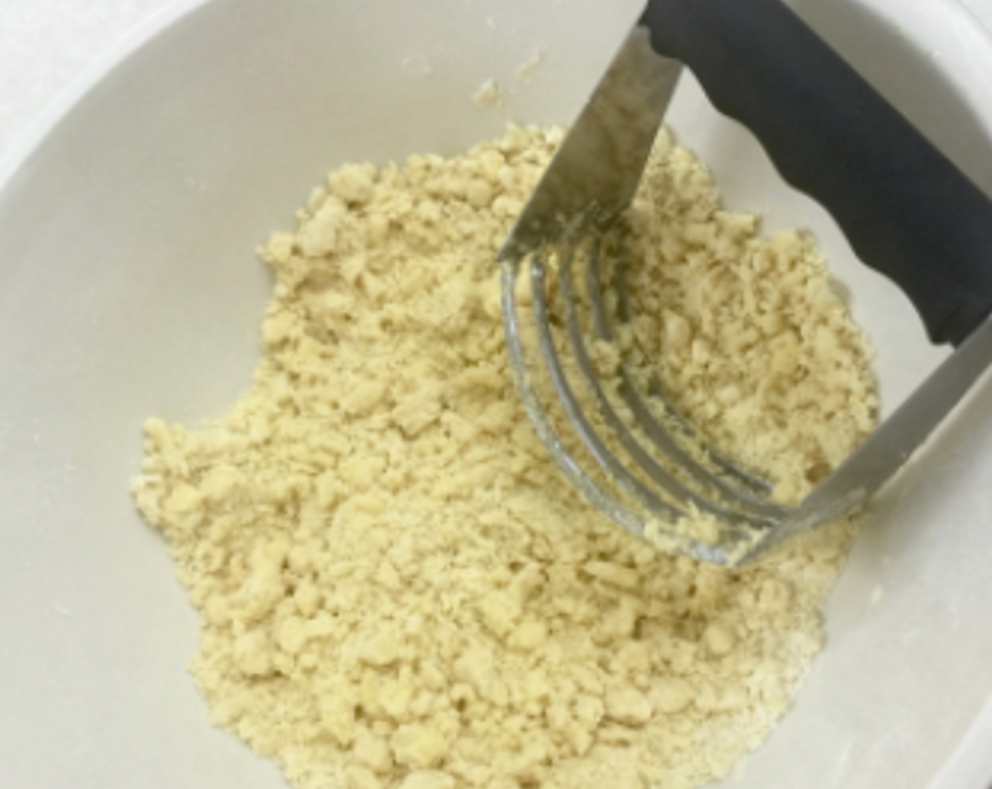 step 4 Using a pastry cutter, cut the butter into the flour until the mixture resembles coarse crumbs. The dough can also be made in a food processor.