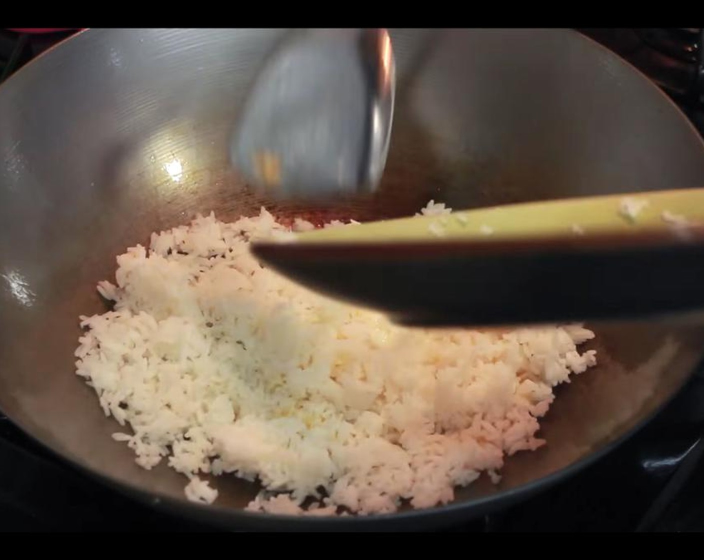 step 3 Add the cooked White Rice (1 cup) to the wok, constantly stirring to mix well.