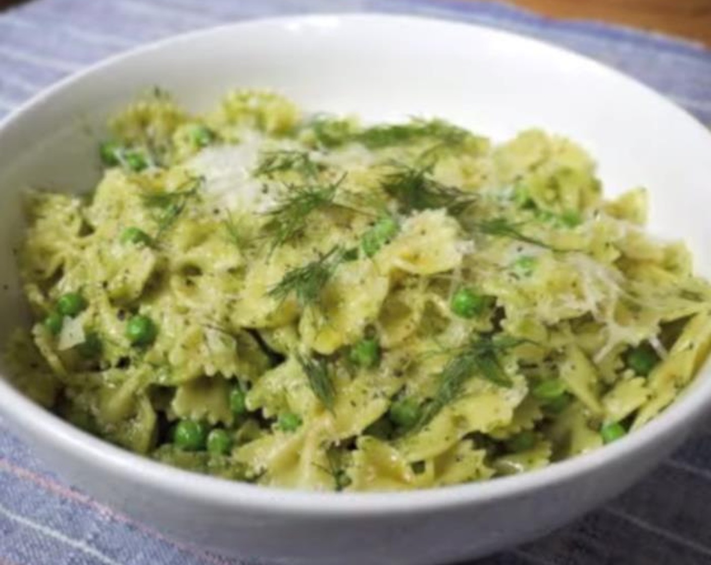 step 3 Drain peas and pasta, then immediately pour into a bowl. Add reserved pasta water and pesto, then mix well. Grate the Pecorino Romano Cheese (to taste) over top, drizzle with more extra Extra-Virgin Olive Oil (to taste). Serve, and enjoy!