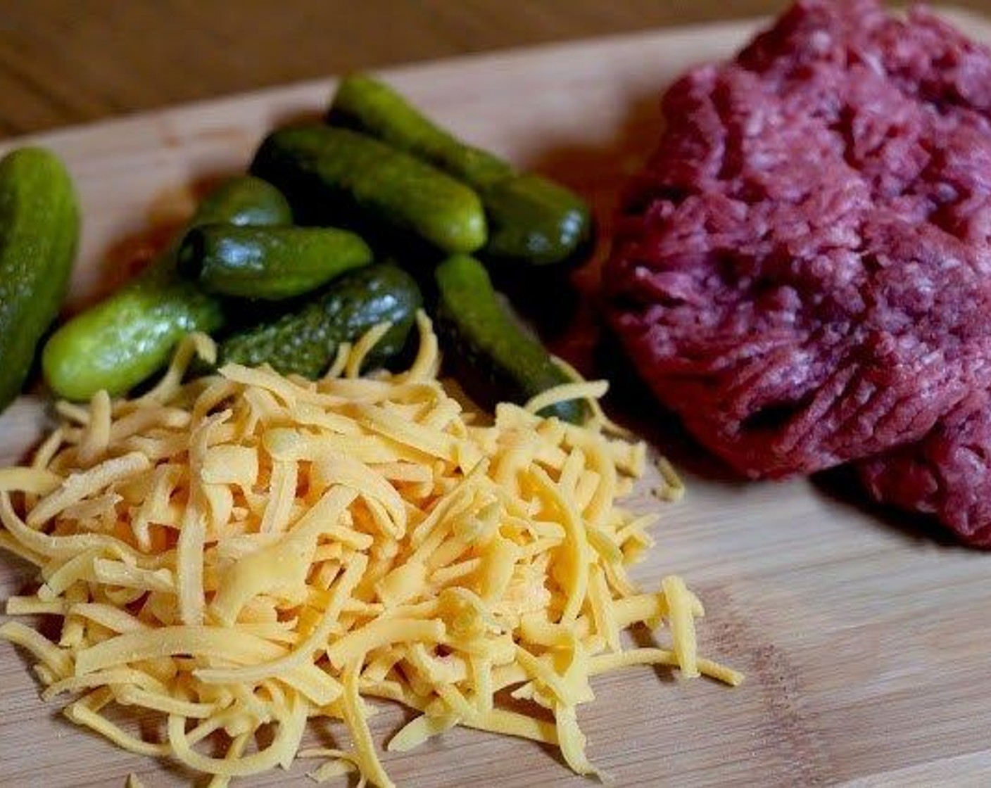 step 4 Place the Ground Beef (1 lb), Sweet Onion (1), and Pickles (1/2 cup) in a bowl and mix to combine.