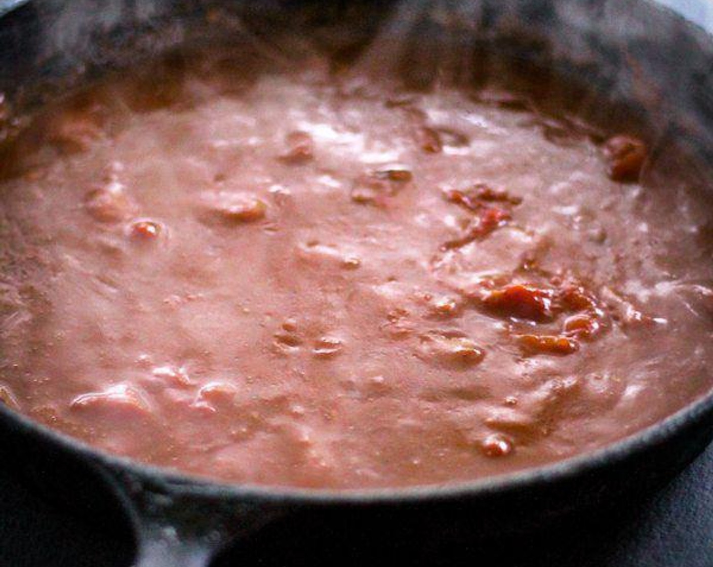 step 4 Crush the tomatoes (by hand) into the gravy mixture, adding all of the liquid. Add the Ground Black Pepper (1/2 tsp) and Salt (1/4 tsp).