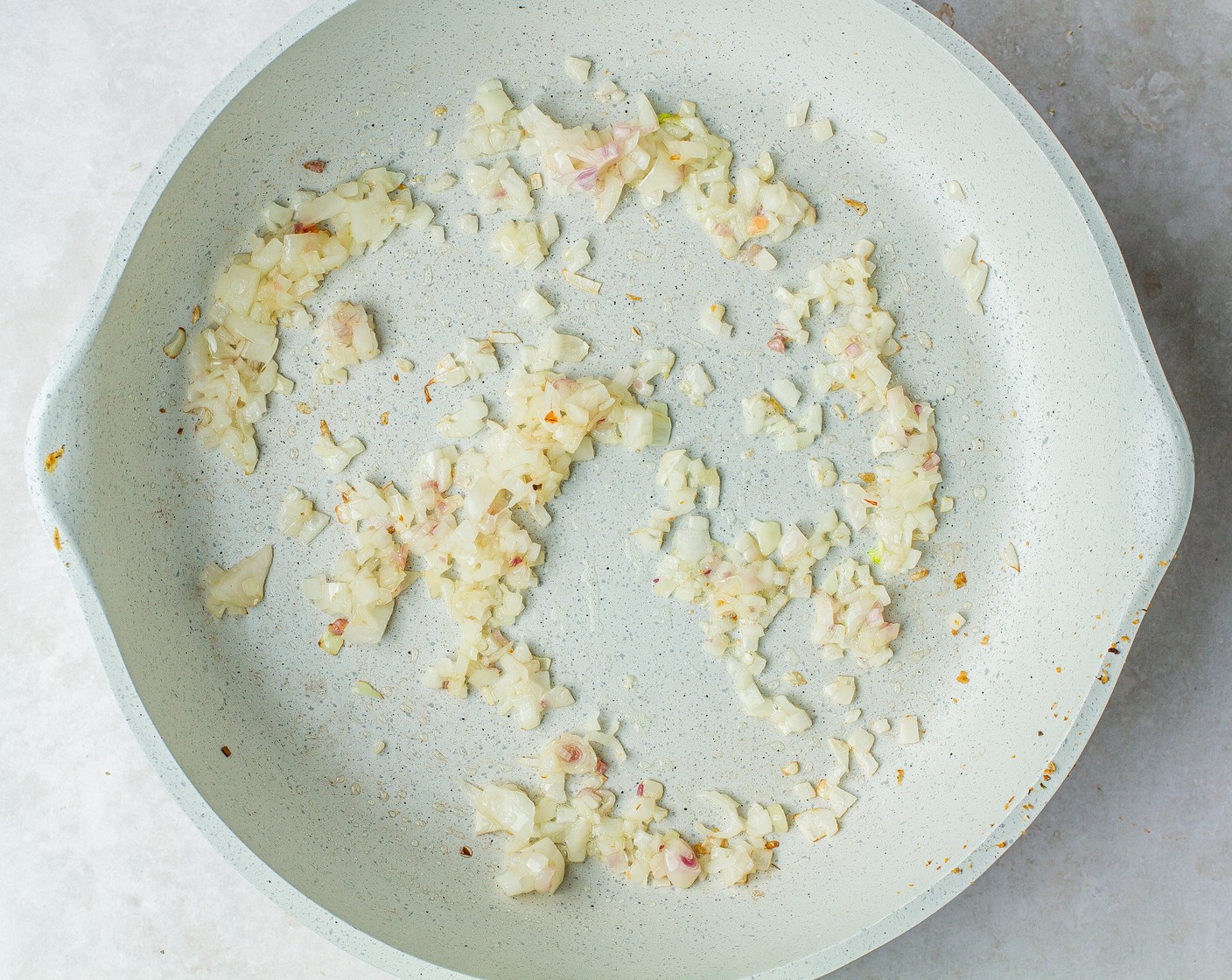 step 3 Return the large skillet to medium-high heat and add the Olive Oil (1 Tbsp) to the skillet. When hot, add Shallots (3) and Garlic (4 cloves) and sauté for 2 minutes.