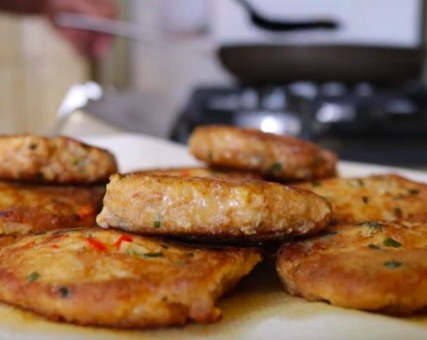 step 14 Start adding the tuna patties into the pan, cook in batches to not over-crowd the pan. Cook for 2 minutes on each side and transfer to a plate with paper towels.