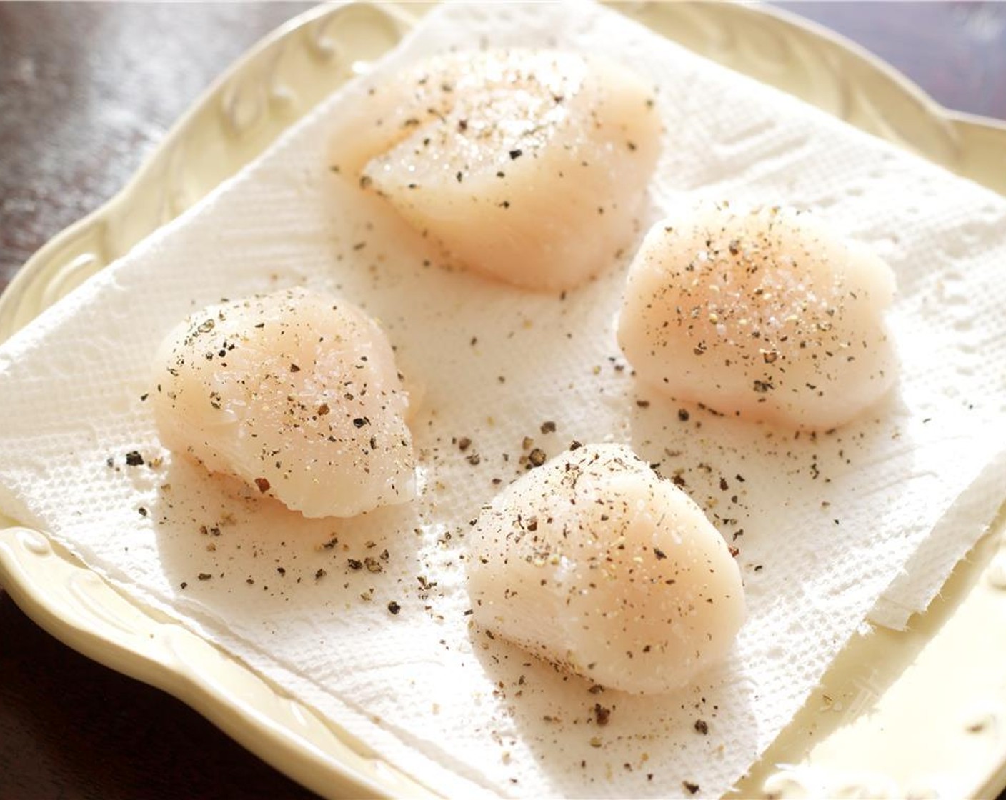 step 6 When the vegetables are almost done, prepare the Fresh Large Scallops (6), and pat dry with a paper towel. Season with a bit of Kosher Salt (to taste) and Freshly Ground Black Pepper (to taste).