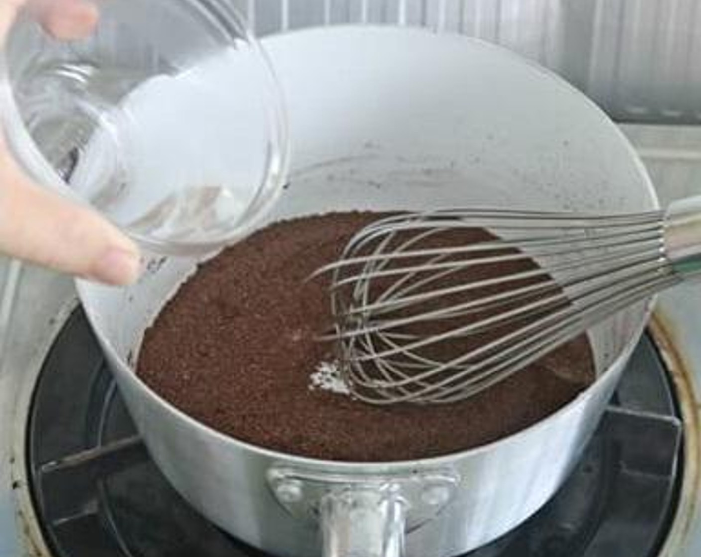 step 1 Combine Unsweetened Cocoa Powder (1 Tbsp) and Caster Sugar (1/4 cup) together in a pot. Add in the Water (1/4 cup) into it and stir well.