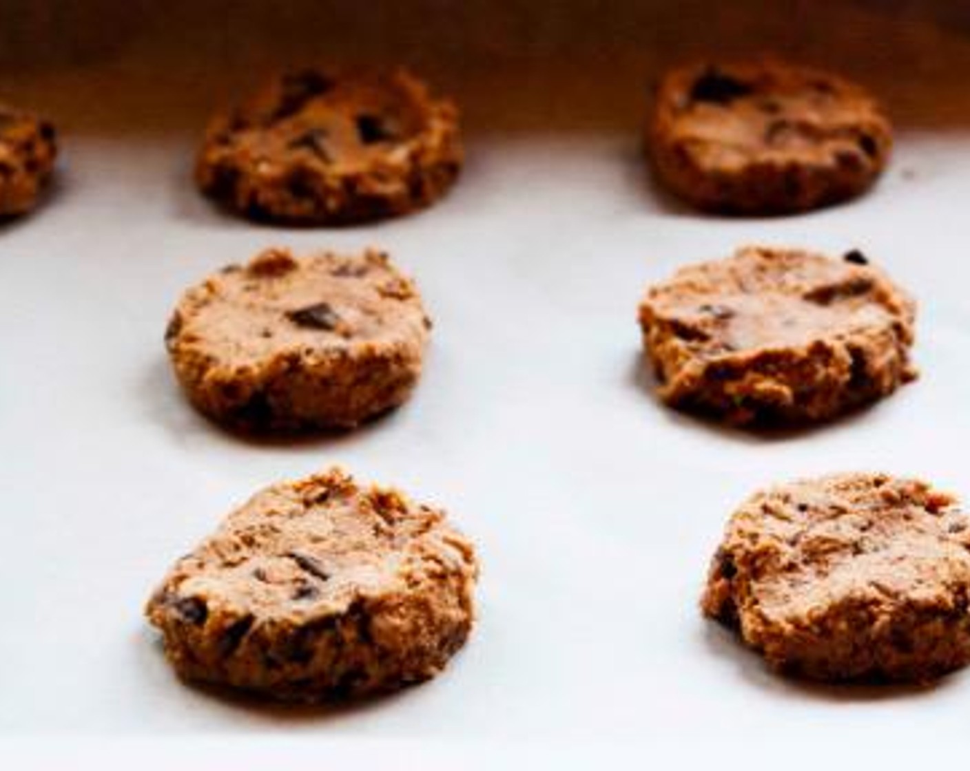 step 5 Drop tablespoons of dough onto parchment paper, slightly flatten them down using your fingers and bake in preheated oven for 10-12 minutes.