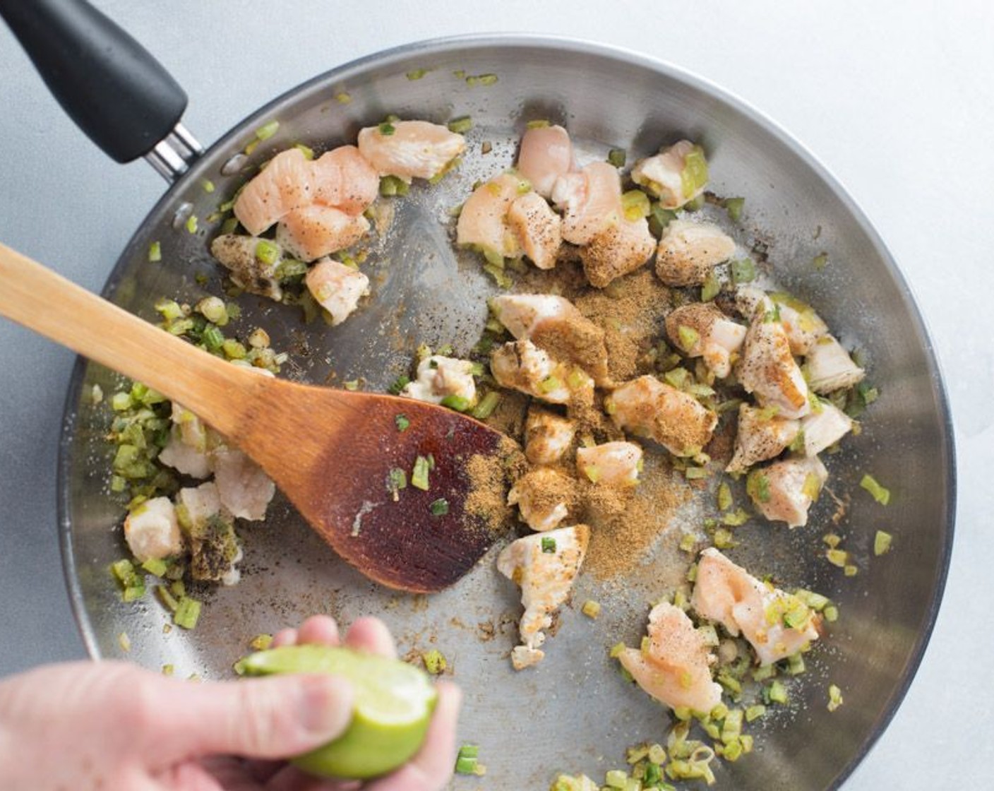 step 3 Add Boneless, Skinless Chicken Breasts (8 oz) to skillet and Salt (to taste) and Ground Black Pepper (to taste) lightly. Squeeze a half of a Lime (1) into the skillet. Slice the remaining of the lime in two to four wedges for serving on a plate.