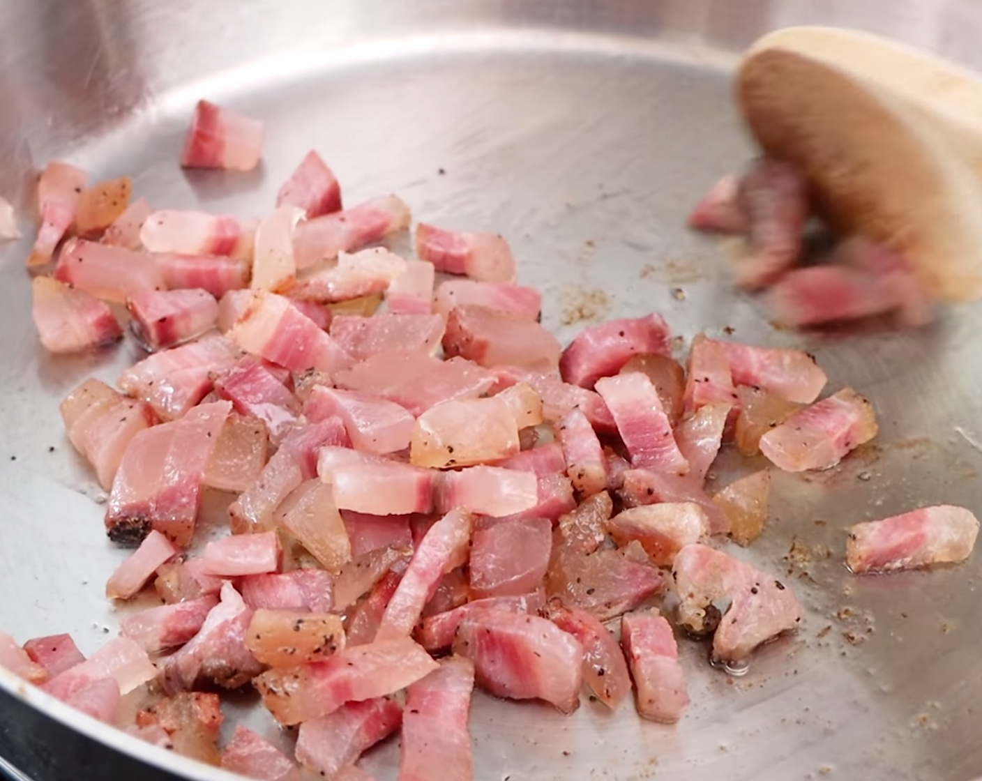 step 4 Put a pan on your stove at a low-medium heat and add the guanciale – no oil! Leave this to slowly cook and crisp in the pan, gently moving it around with a wooden spoon every so often.