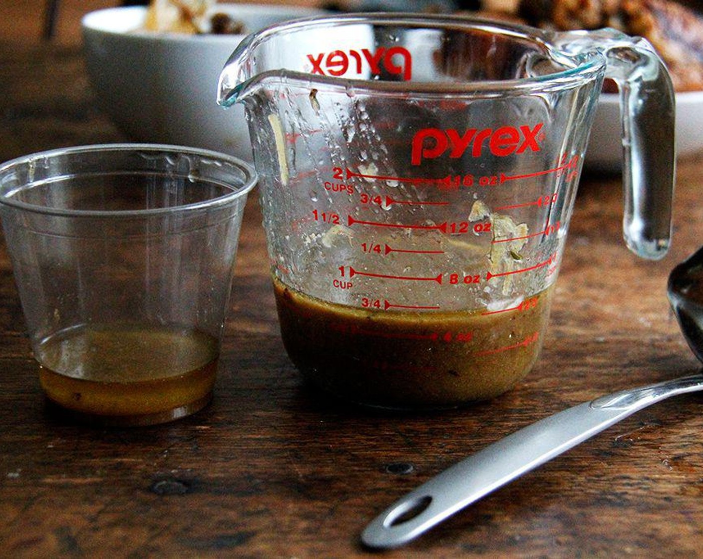 step 6 Using a spoon, swirl around the sauce and take a taste. If it tastes good, serve it. If it tastes fatty, transfer the meat and shallots to a platter, pour the juices into a Pyrex and let them sit until the fat rises, about 5 minutes. Skim off the fat.