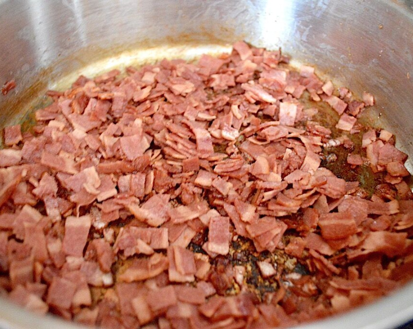 step 1 First, get a large pot on to boil for the pasta. Then get out a large skillet and put the Turkey Bacon (14 slices) in it cold. Heat it up over medium-high heat and let it cook until crisp.