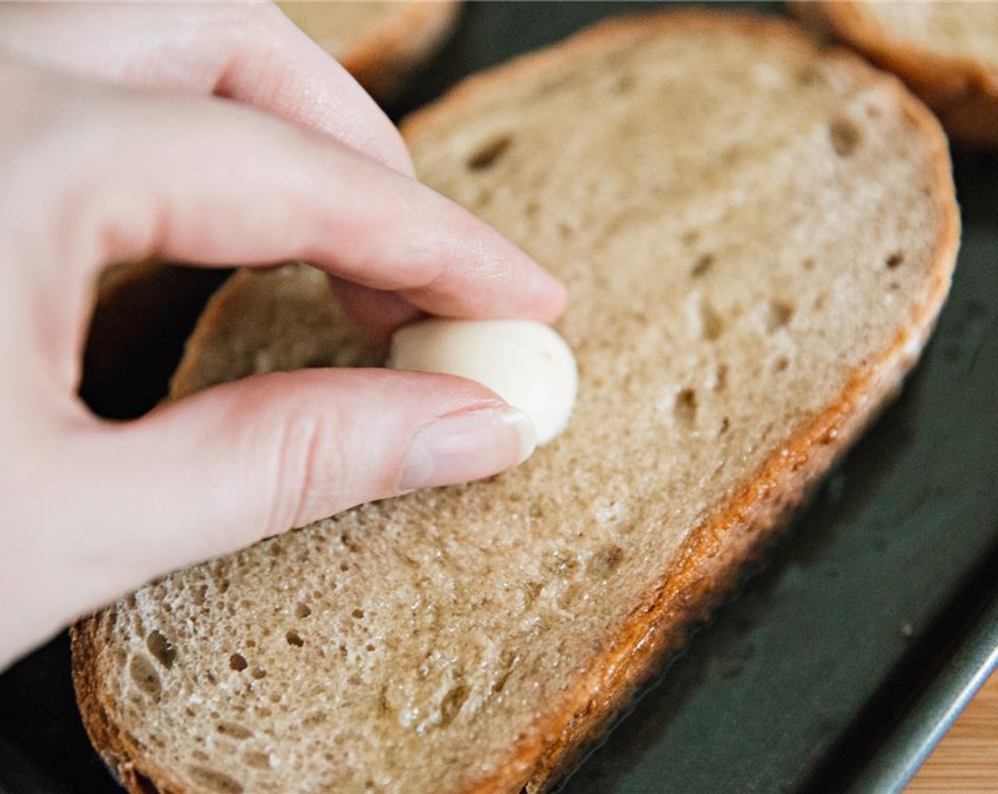 step 9 Cut Garlic (1 clove) in half and rub each piece of bread with cut half. Place under a grill and toast on each side.