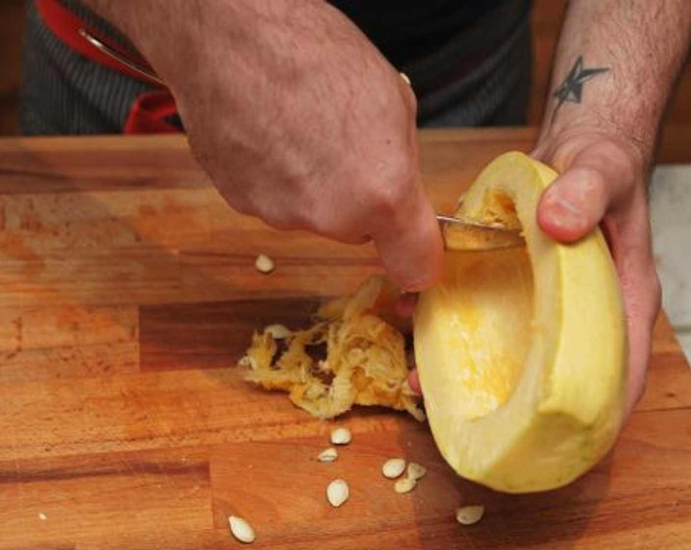 step 5 Using a large chef’s knife, cut the Spaghetti Squash (1) in half from the stem end to the blossom end. Scoop out the seeds with a large metal spoon and discard. Brush cut side of squash halves with about 1 tablespoon Olive Oil (to taste).