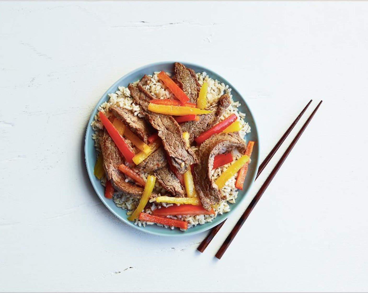 step 8 Add rice to a plate and top with the beef stir fry. Serve and enjoy!