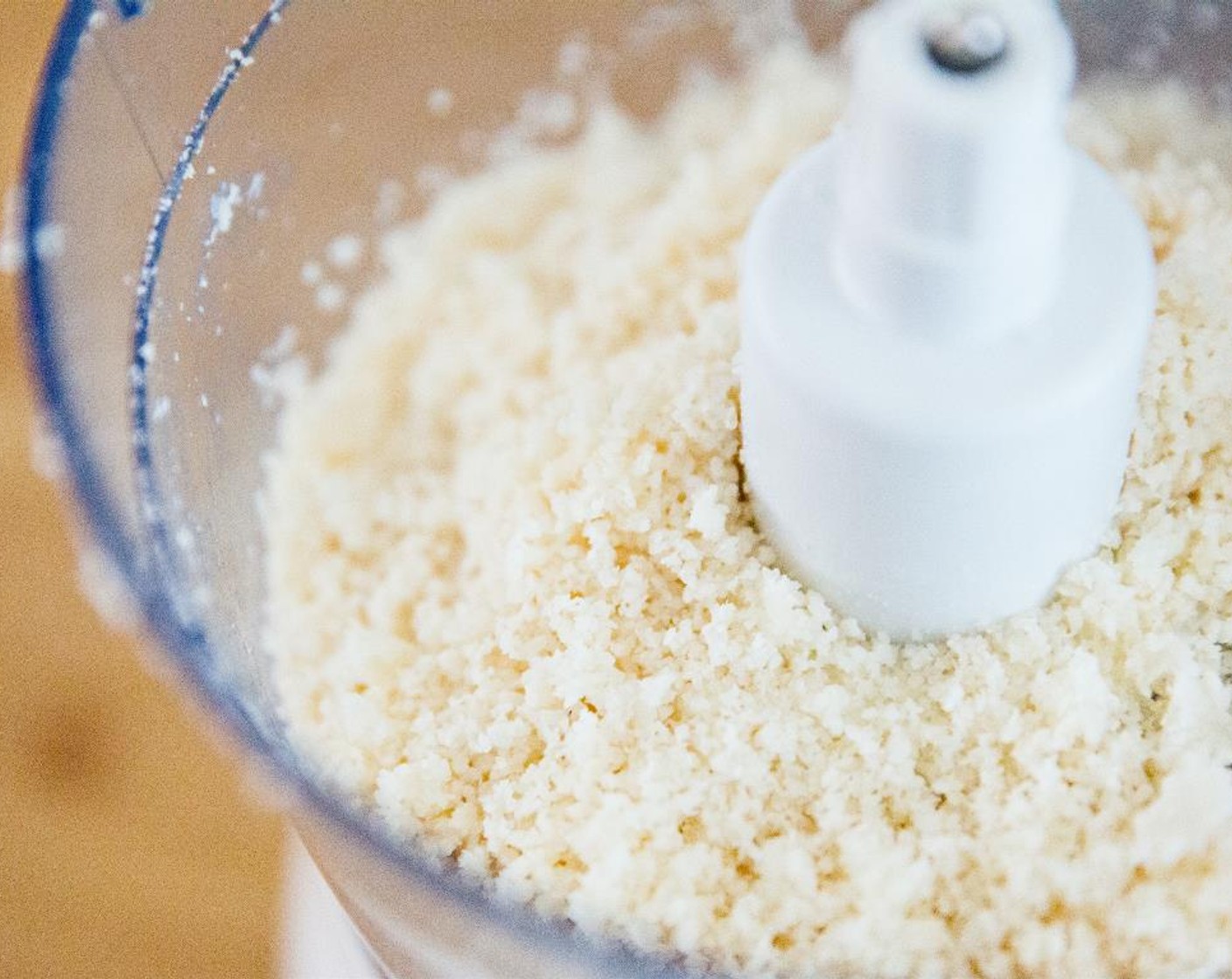 step 2 Blend on high until it begins to form a coarse paste, stopping the food processor and scraping down the sides of the bowl as you go.