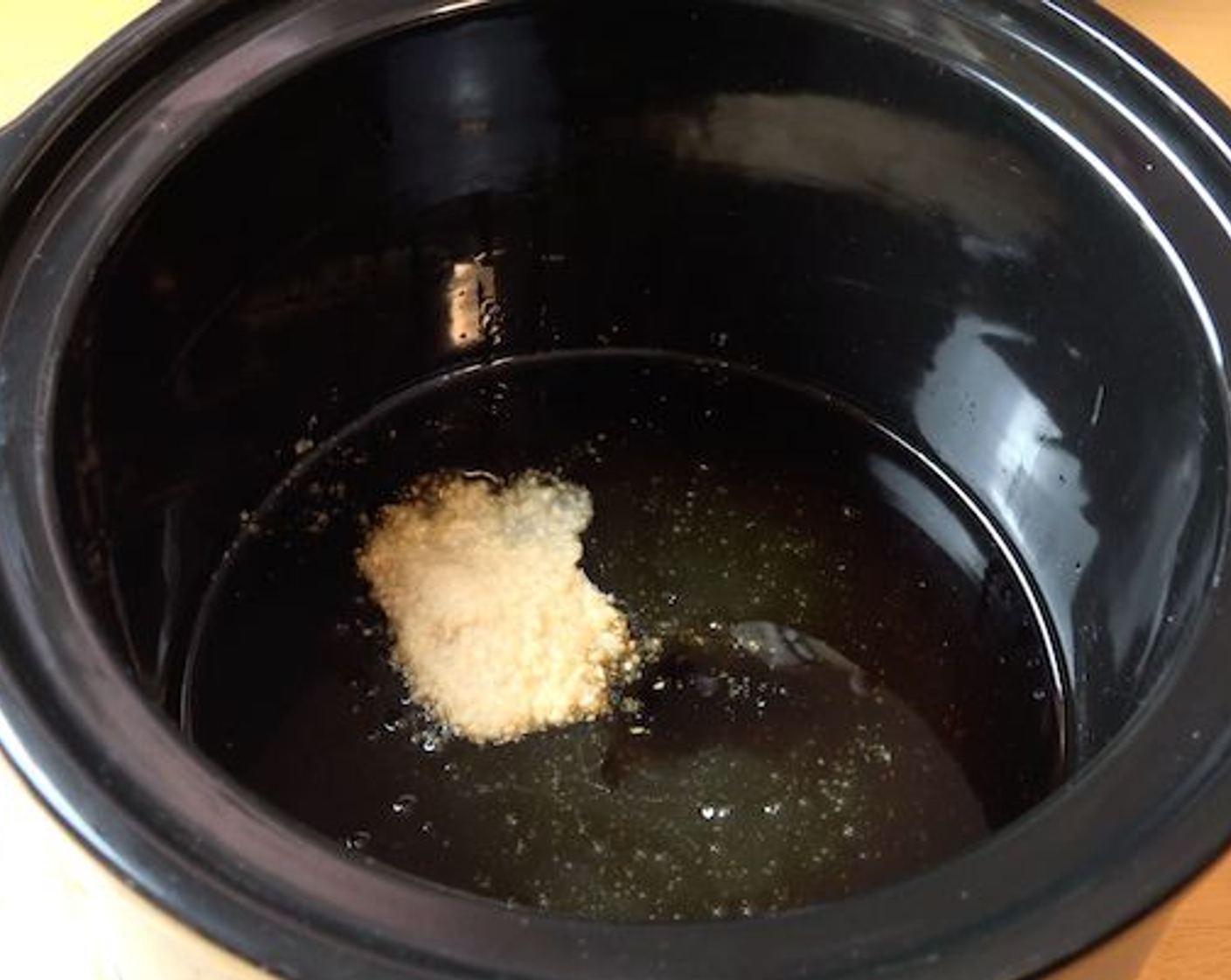 step 2 Into your slow cooker, add Honey (1 cup), Soy Sauce (1/2 cup) and Garlic (2 cloves). Mix everything together.