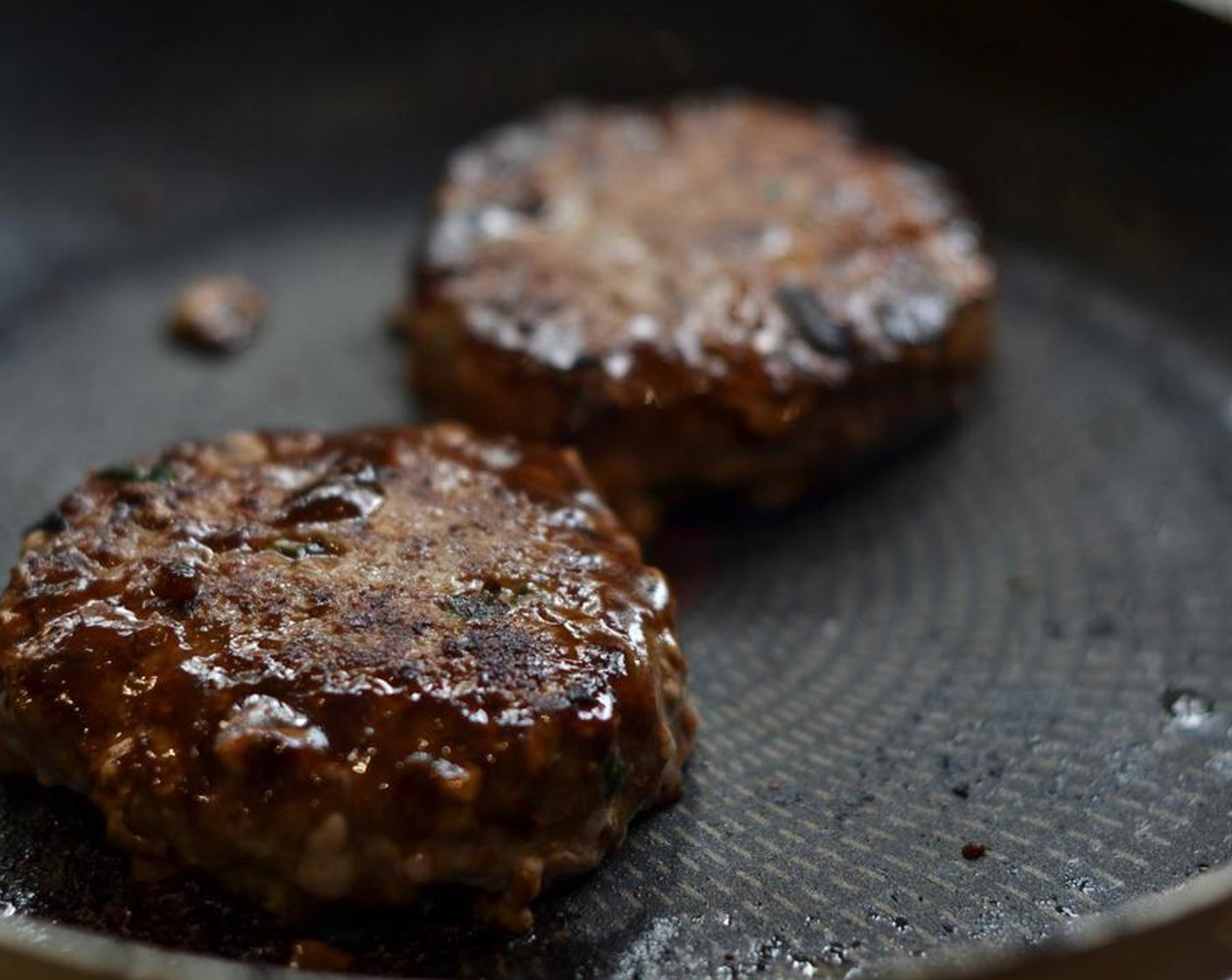 step 7 To cook the burger, heat a griddle pan to screaming hot and place each patty on it to sear for about a minute or so.