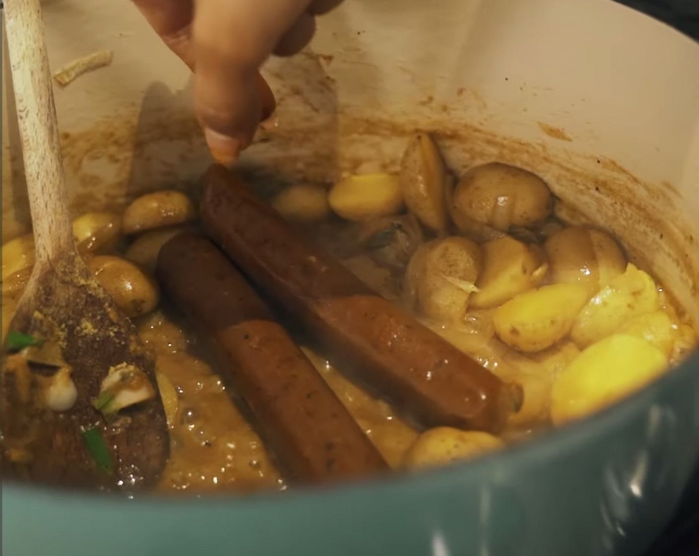 step 5 Cook for a few more minutes before adding your Vegan Chipotle Sausage (1 pckg) and the juice from Lemon (1). Using your wooden spoon, break apart the sausage and stir around to incorporate it into the potatoes.