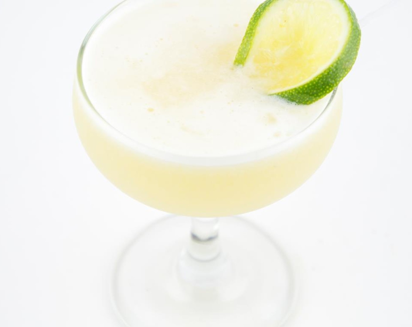 step 6 Discard the ice from the sour glass. Strain and pour into the chilled sour glass and garnish with Lime (1).