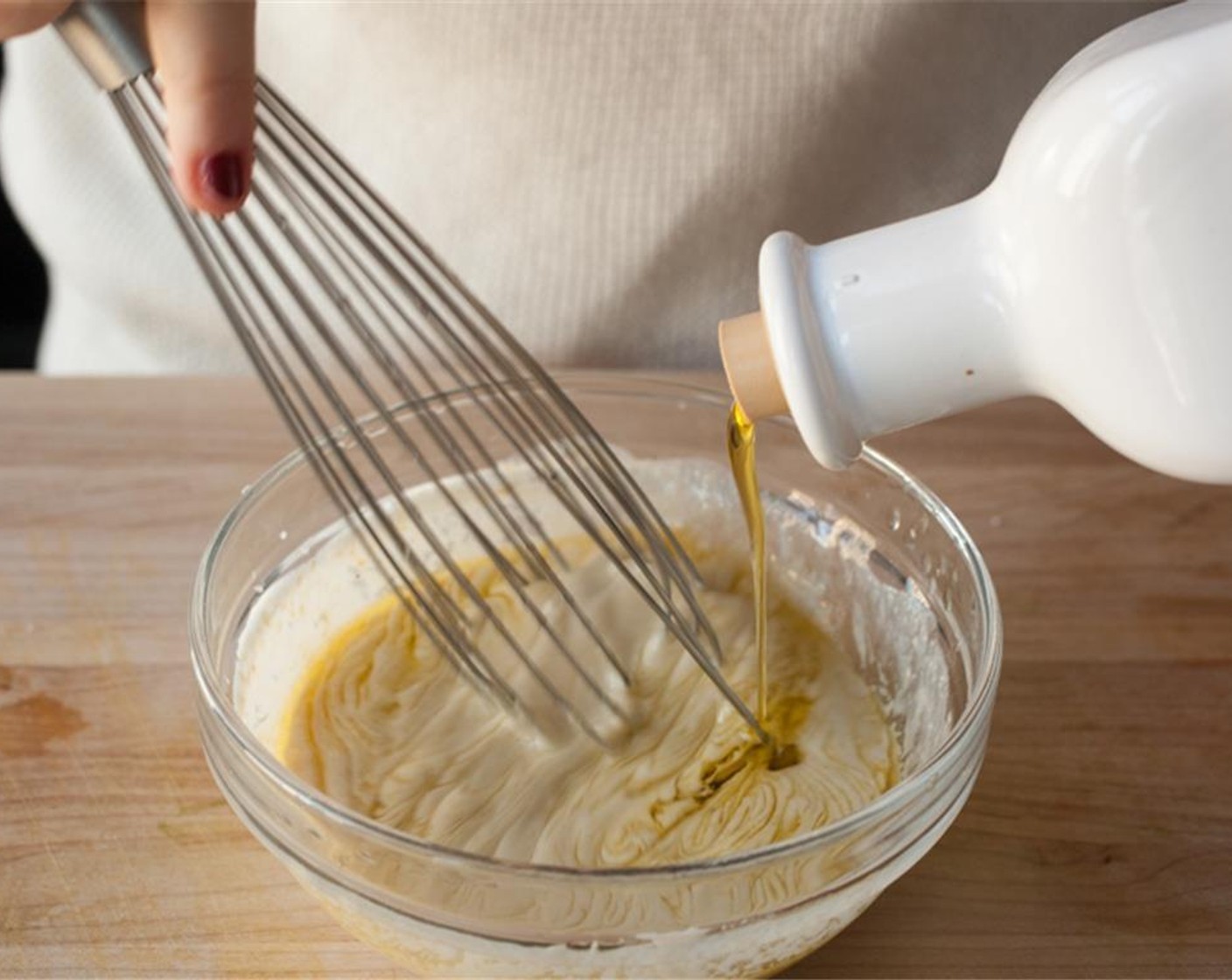 step 4 In a small bowl, whisk together Tahini (1 Tbsp) with 2 tablespoons warm water until combined. Whisk in Fat-Free Greek Yogurt (4 Tbsp), garlic,  juice of remaining ½ lemon, and Olive Oil (2 Tbsp). Taste and add Kosher Salt (to taste) and Ground Black Pepper (to taste) as needed. Set aside.