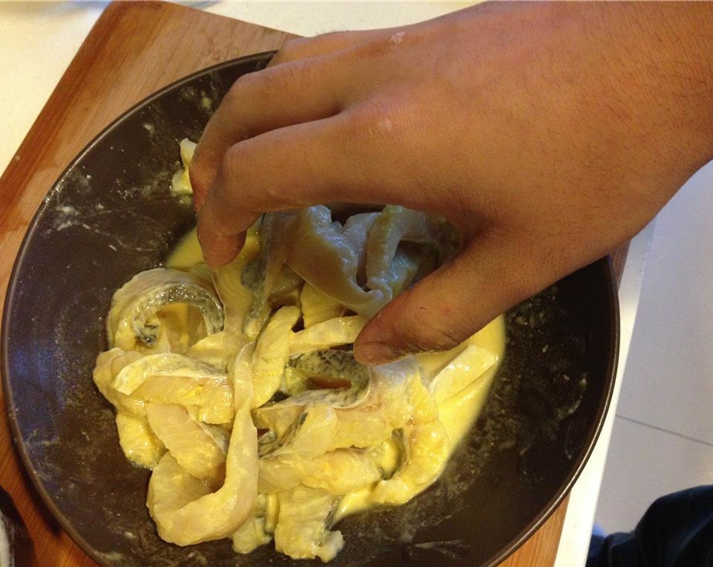 step 4 Add the fish and massage it into the cornstarch mixture. Let it marinate for 10 minutes.