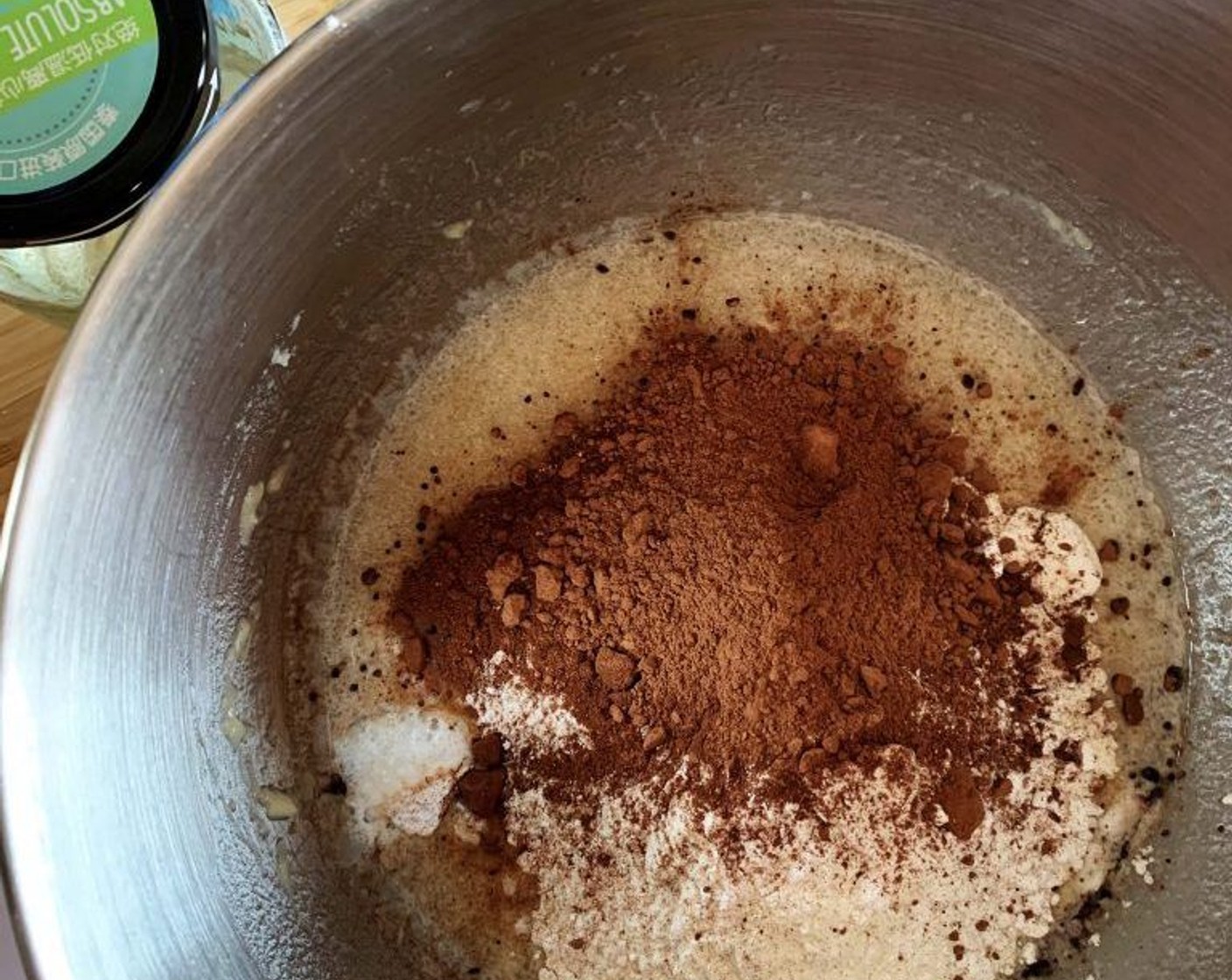 step 3 Add the Coconut Oil (4 Tbsp) and Water (3/4 cup) and mix well. Next fold in All-Purpose Flour (1 2/3 cups), Unsweetened Cocoa Powder (1/2 cup), and Baking Powder (1 tsp).