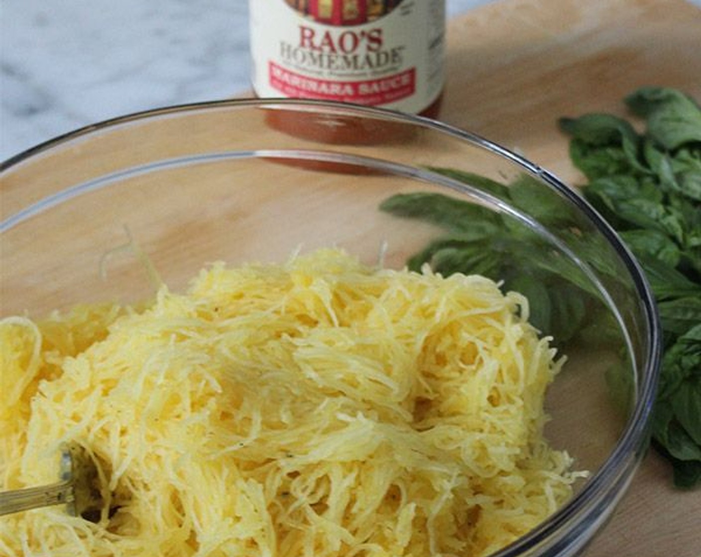 step 7 Using a fork, scrape the squash to loosen it from the skin and transfer all the squash flesh to a colander, reserving the squash shells. Using your hands, firmly press the squash to drain any excess moisture.