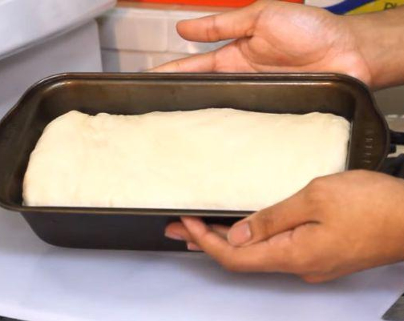 step 4 Take the dough and form it into a loaf. Place in a pan - I used a 9x5 inch loaf pan - and cover with a kitchen towel. Let sit for another 30 minutes in a warm place.