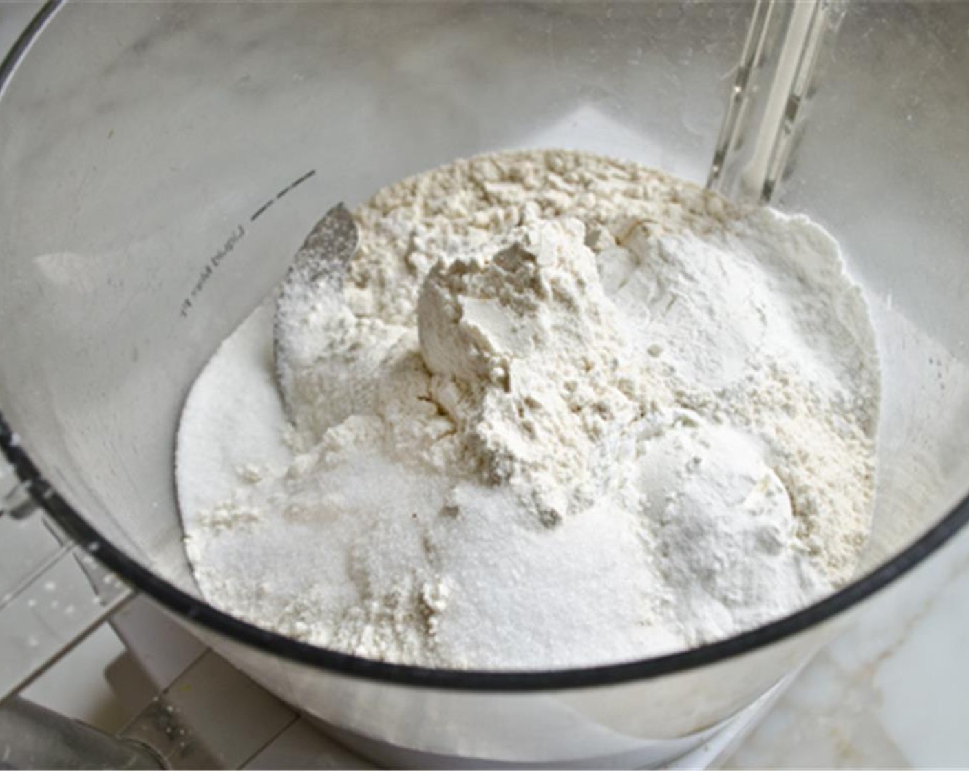 step 2 In the bowl of a food processor, combine the All-Purpose Flour (2 cups), Corn Starch (1/4 cup), Baking Powder (1 Tbsp), Baking Soda (1/4 tsp), Granulated Sugar (1 Tbsp) and Salt (1 1/4 tsp). Pulse a few times to mix.