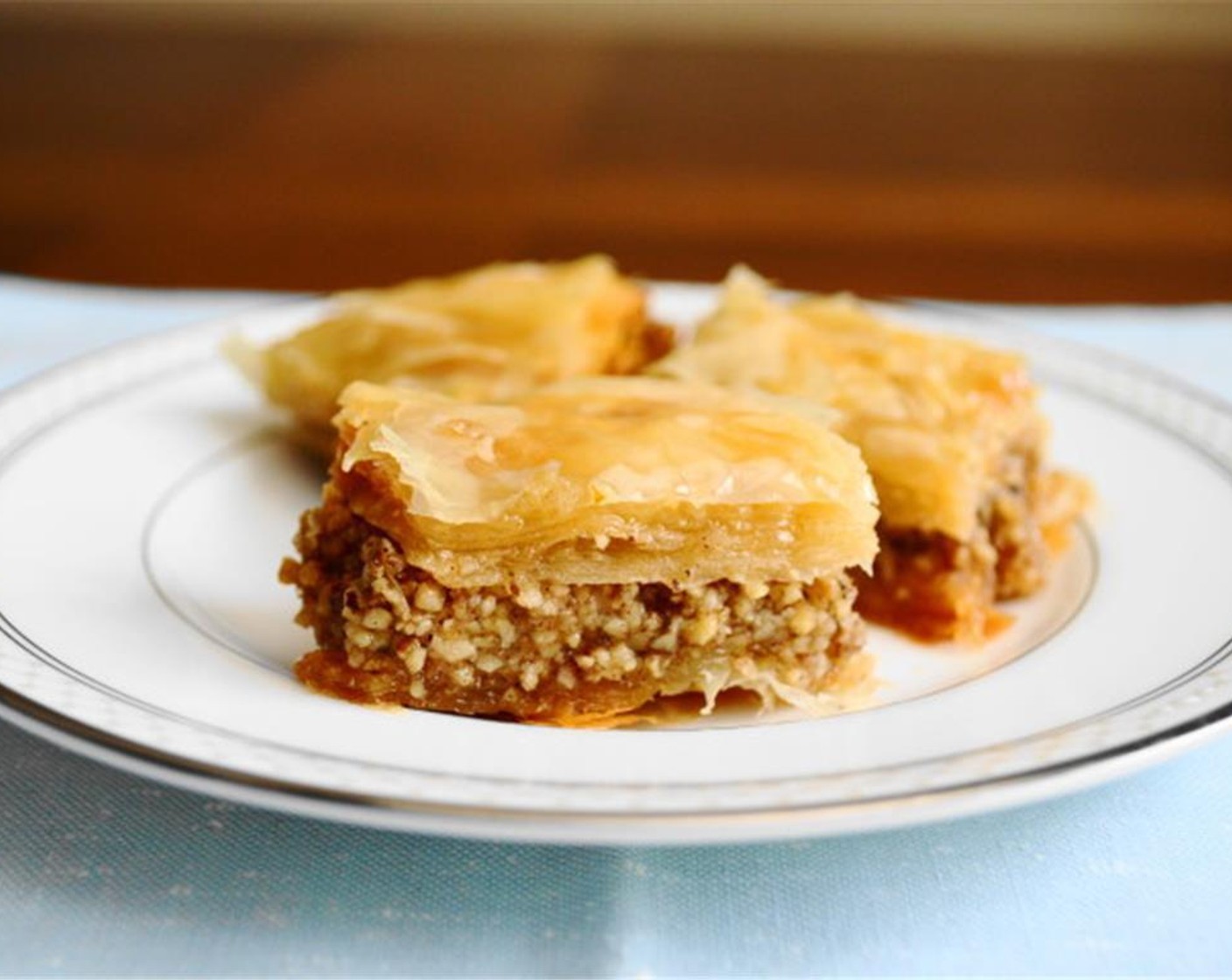 step 11 Take the baklava out of the oven when it's done and immediately pour the syrup all over it. Let cool enough to handle. Store it in a sealed container for a couple of days!