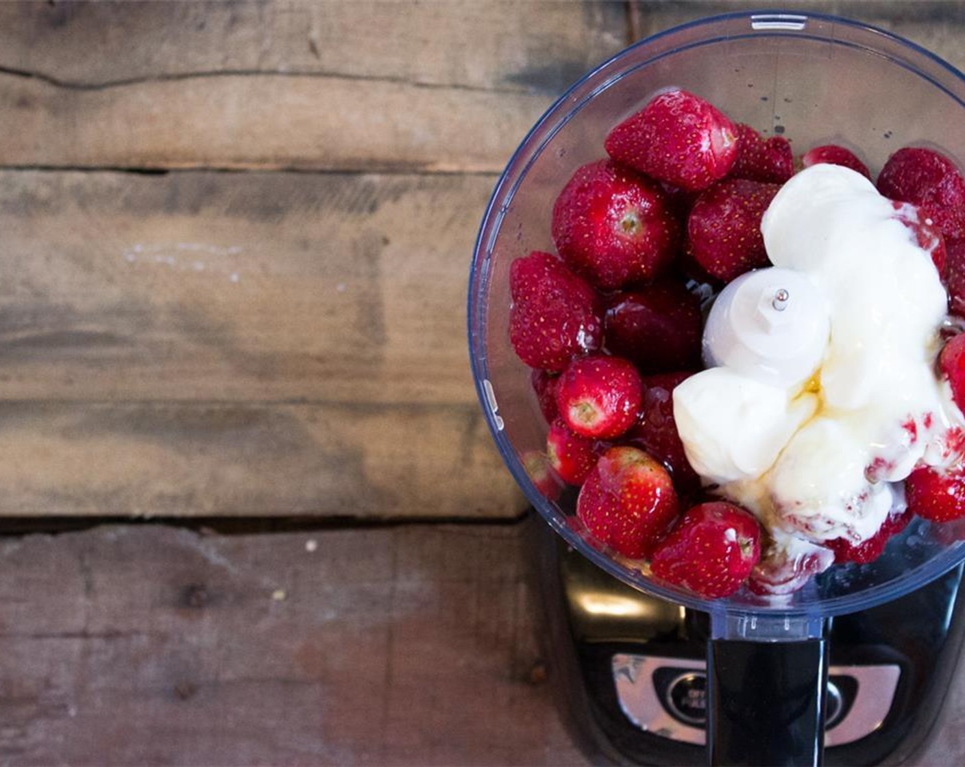 step 2 Juice the Lemon (1/2). Place frozen strawberries, Honey (4 Tbsp), plain Greek Yogurt (1/2 cup) and lemon juice in a food processor.