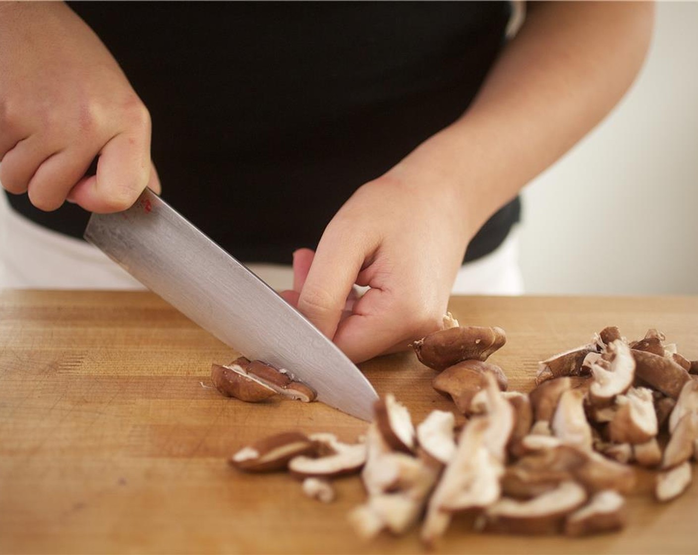 step 4 Remove stems from Shiitake Mushroom (1 cup). Slice into 1/2 inch pieces. Slice French Baby Carrots (6) in half lengthwise. Slice the Lemon (1) into 1/4 inch rounds. Set aside.