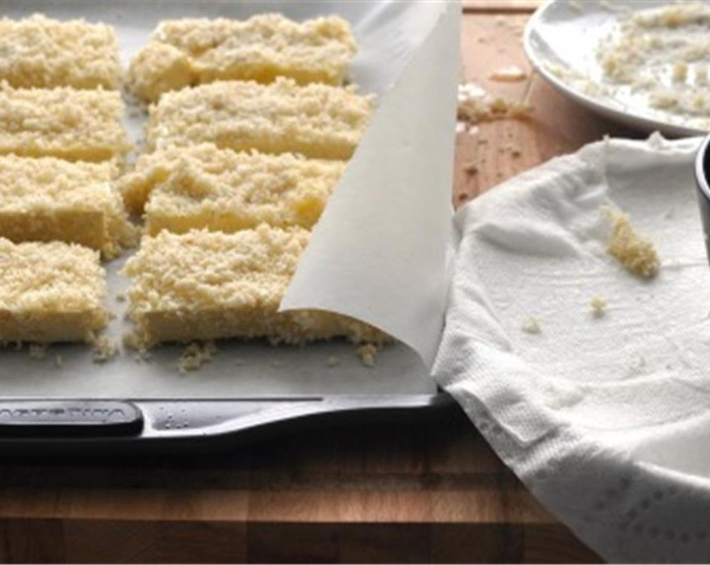 step 6 Dip tofu slices in the egg and coat with panko crumbs. Place on the prepared baking sheet. Bake for 20 minutes, until golden brown, flipping midway through.