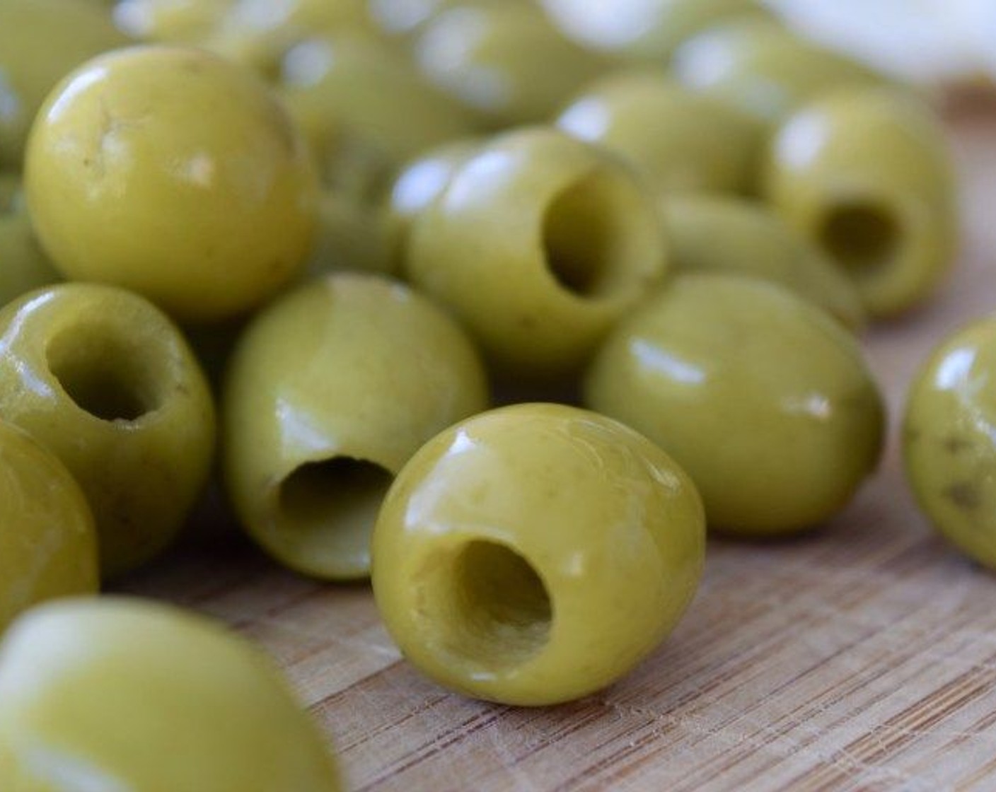 step 1 Drain and rinse the Pitted Green Olives (2 cans). Shake excess water off.