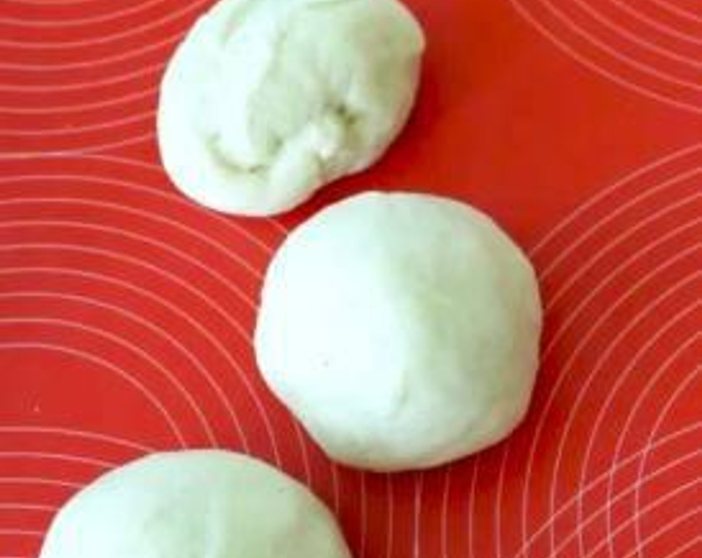 step 5 Divide the dough into 8 pieces, press it to form a dish. Add in red bean paste filling, seal it and roll a ball.