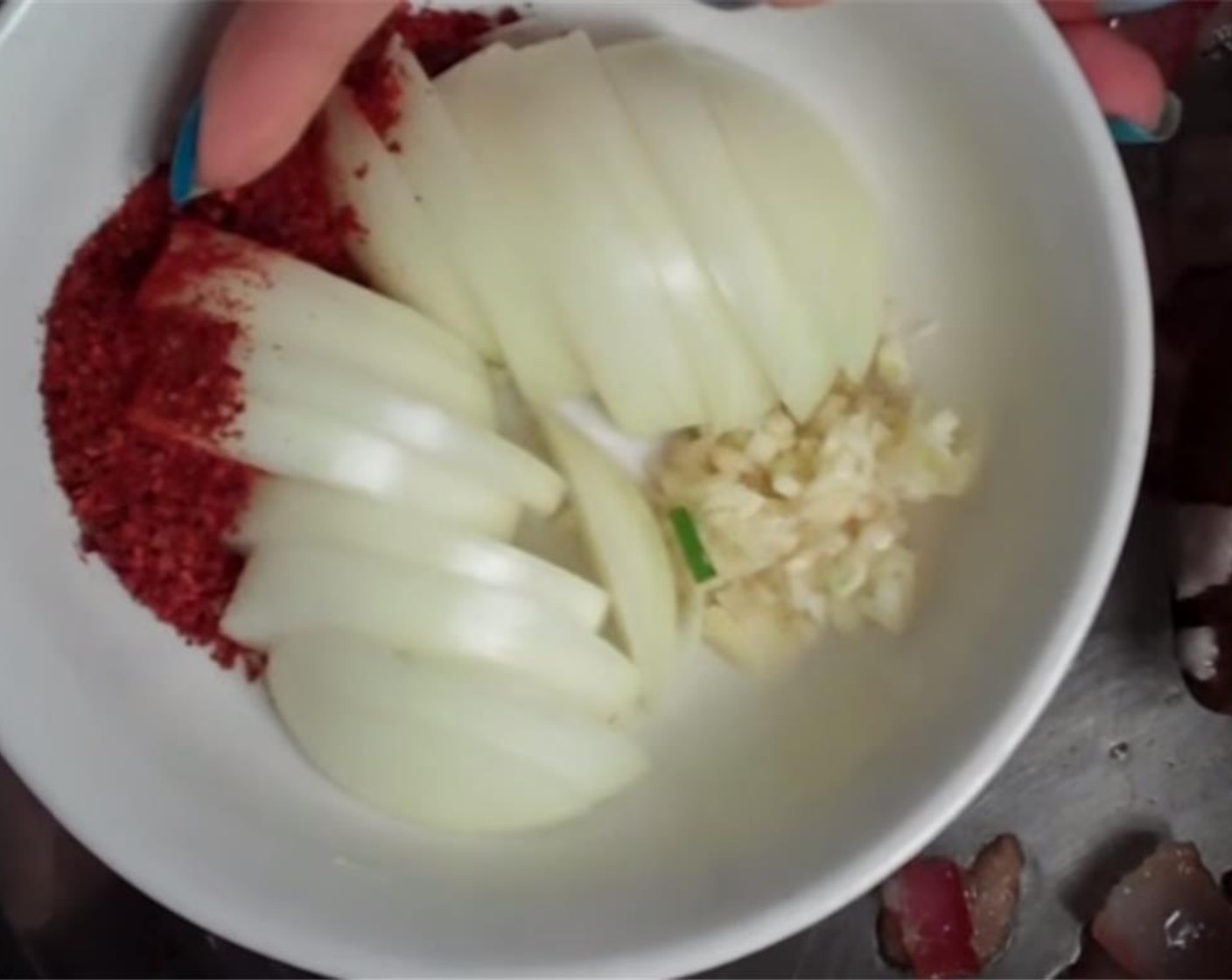 step 3 Stir in the Onion (1/2), Garlic (2 cloves), and Korean Chili Flakes (1/2 Tbsp) until softened a bit.