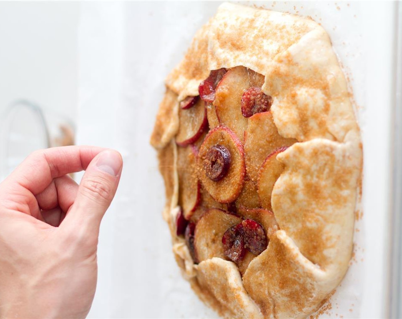 step 9 After the hour has passed, remove galette and brush exposed pastry edge with the Kemps Half & Half (1 Tbsp). Combine Coarse Sugar (1 Tbsp) sugar with remaining Cinnamon and sprinkle evenly over the galette.